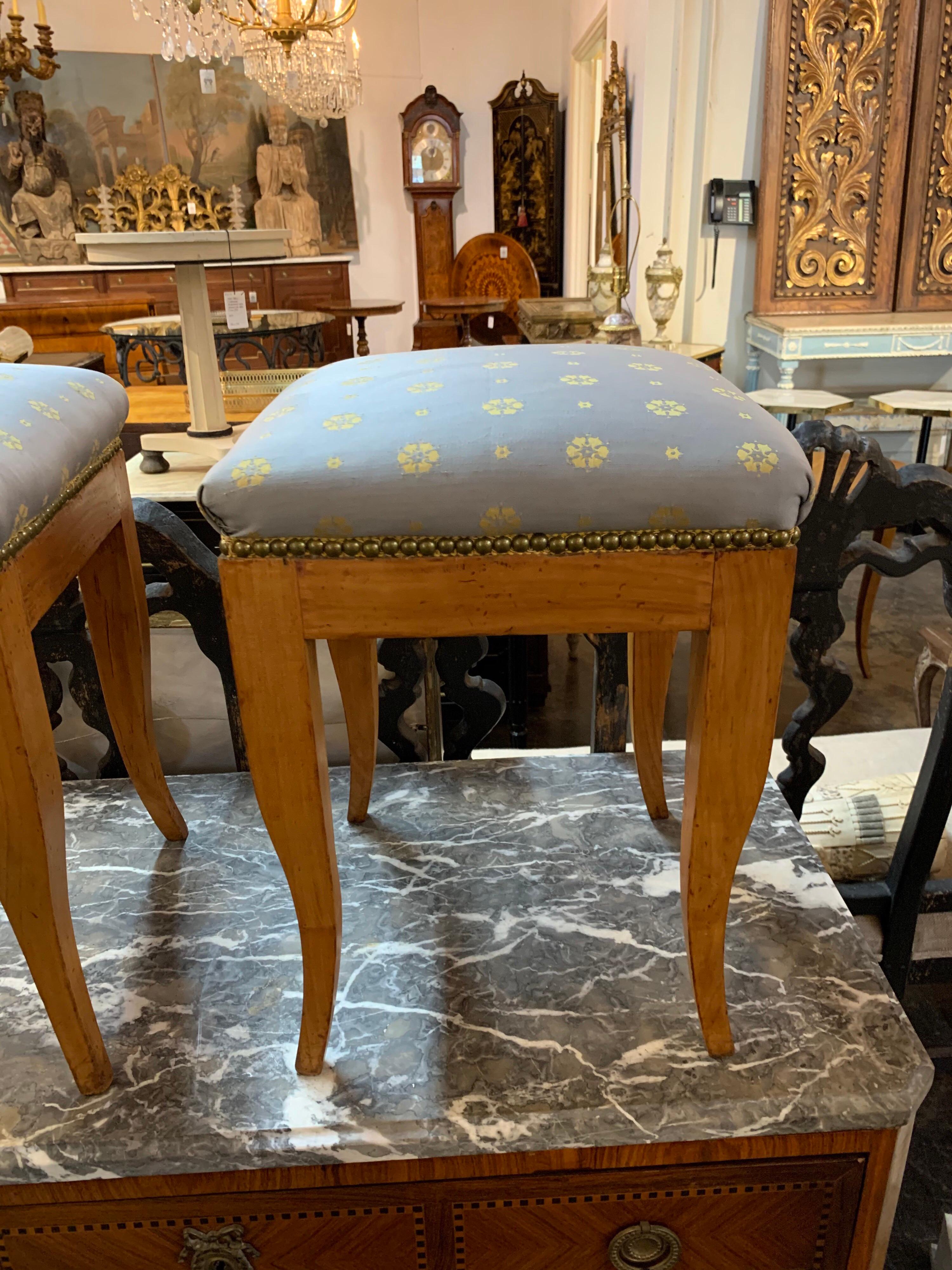 Lovely continental fruitwood Biedermeier style stools. Upholstered in a beautiful grey and gold fabric. Very nice accessory for an elegant home! Note: Price listed is per item.