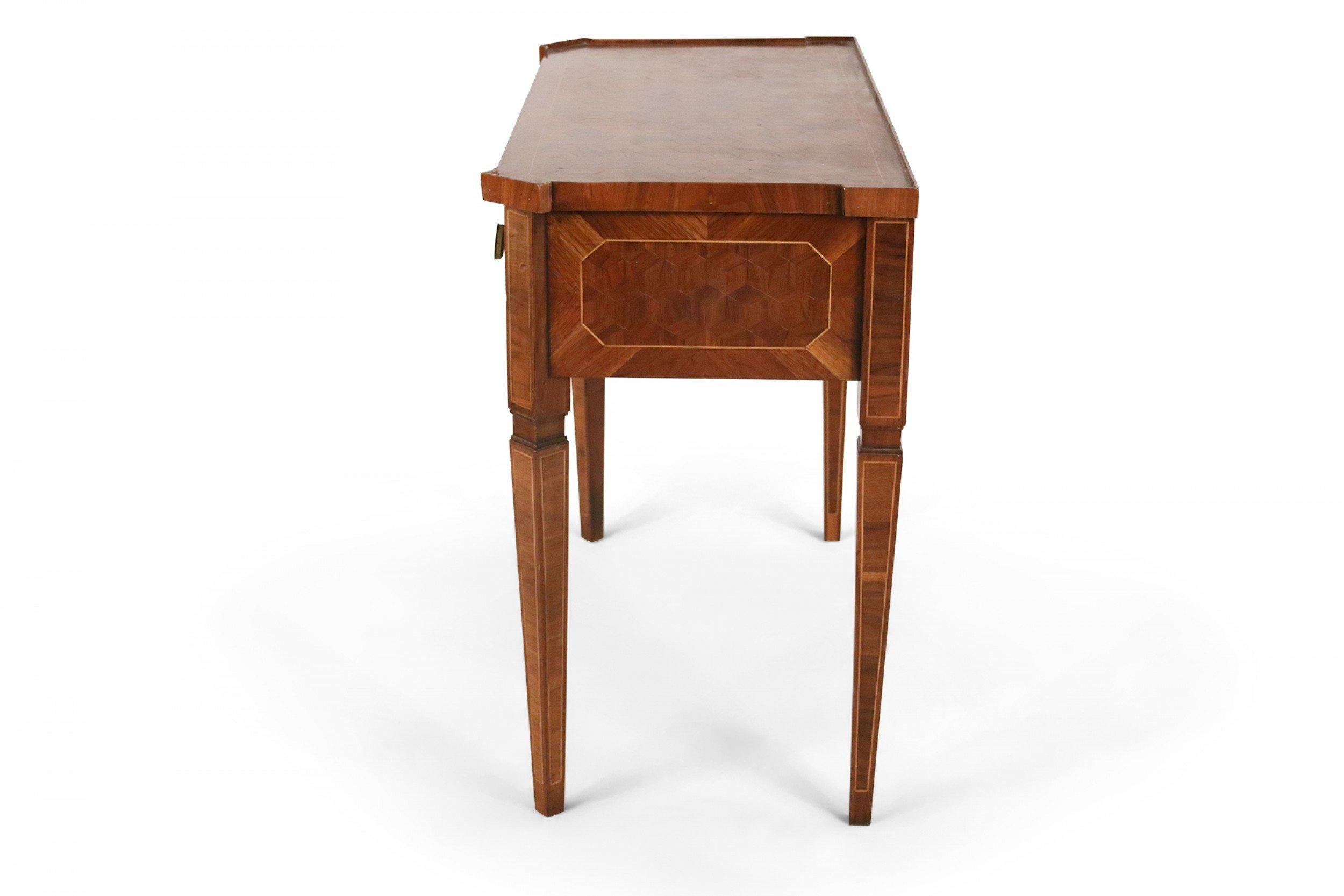 Continental German (early 19th century) mahogany console table having a low border top with parquetry veneer, single drawer with two brass drawer pulls, with four tapered square legs.