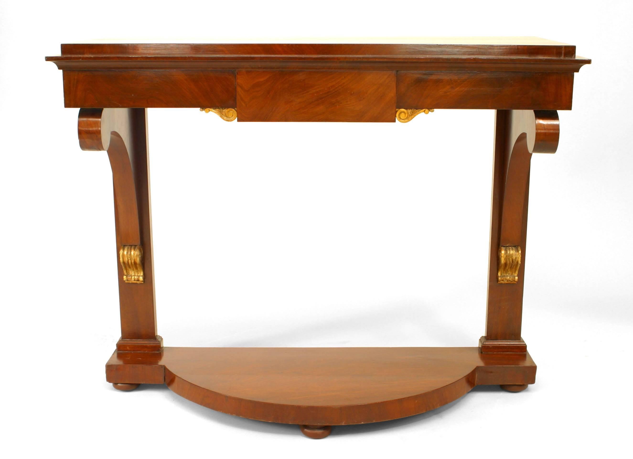 Continental German-style (1st Half of 19th Century) mahogany console table with scroll sided supported on a demilune form platform base.
