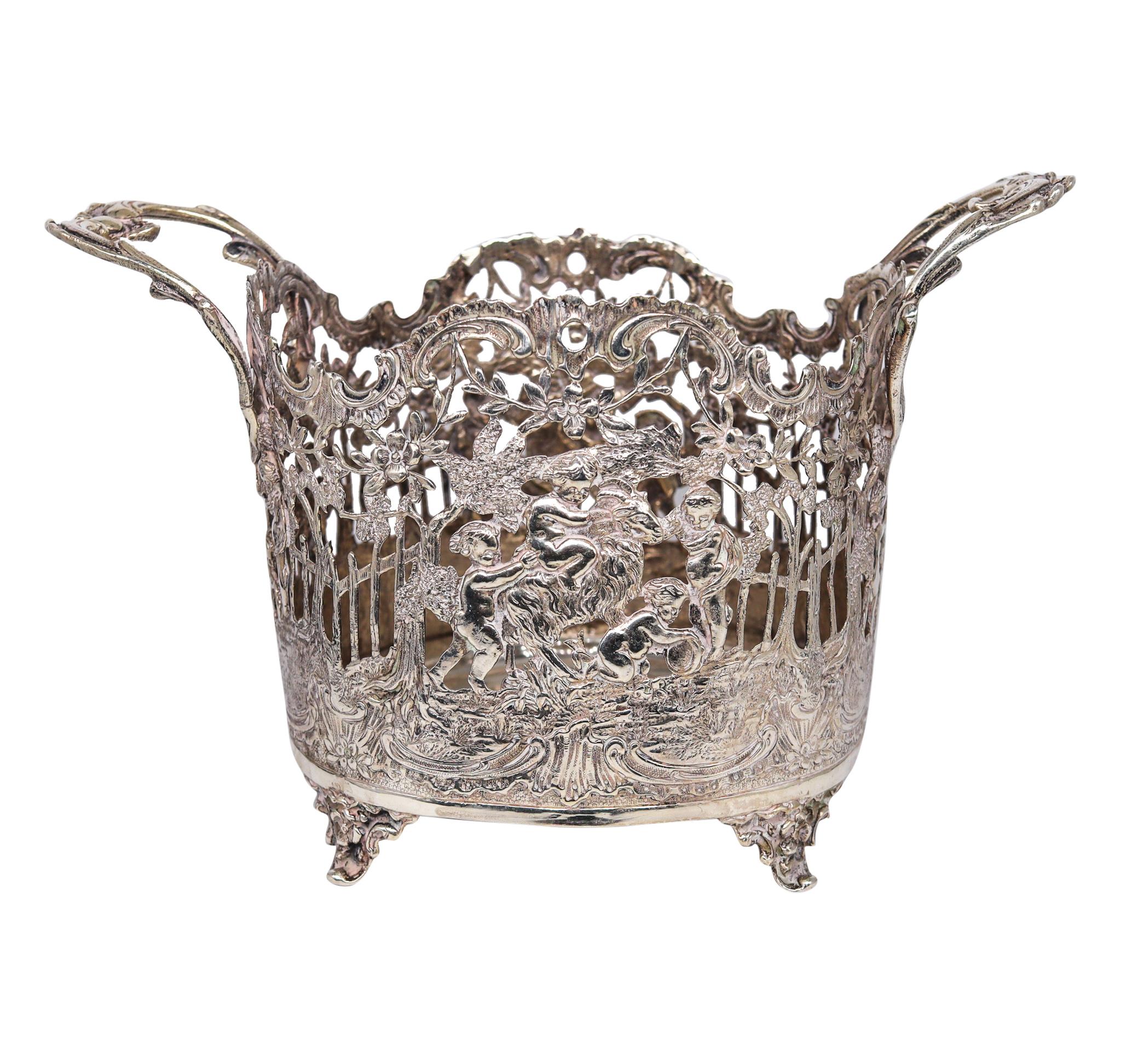 Continental German neoclassic jardinière in silver.

A beautiful highly decorated antique piece, most probably made in Hanau Germany during the Imperial period, circa 1900. This semi oval centerpiece jardiniere was decorated, with Baroque and Art