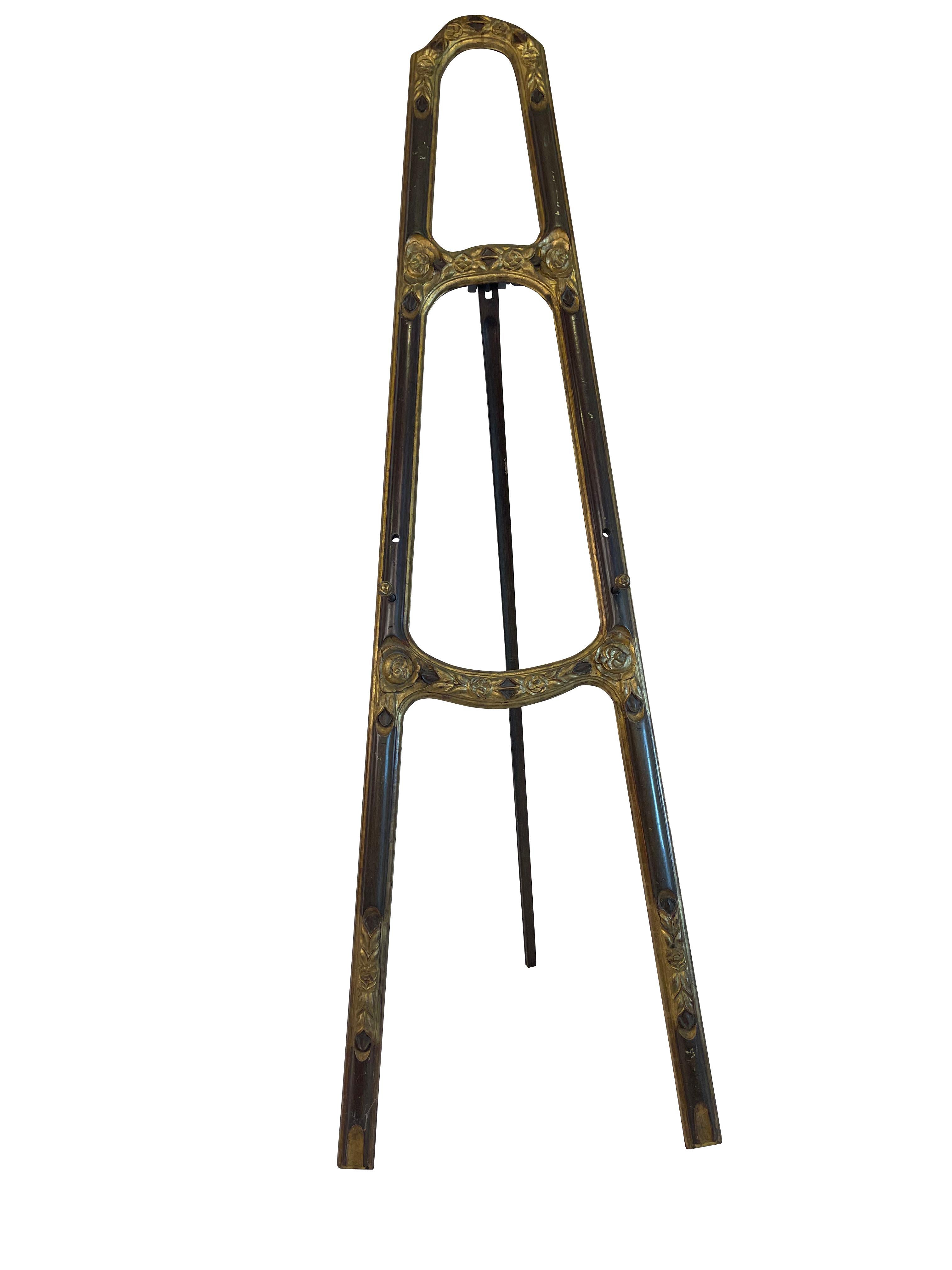 Interesting continental hand-carved painting easel with gilt decoration. Lovely gilded carved- rosette decoration and graceful legs. small dowels adjust t hold different sizes of artwork. Very sturdy. Perfect for displaying artwork or signage for an