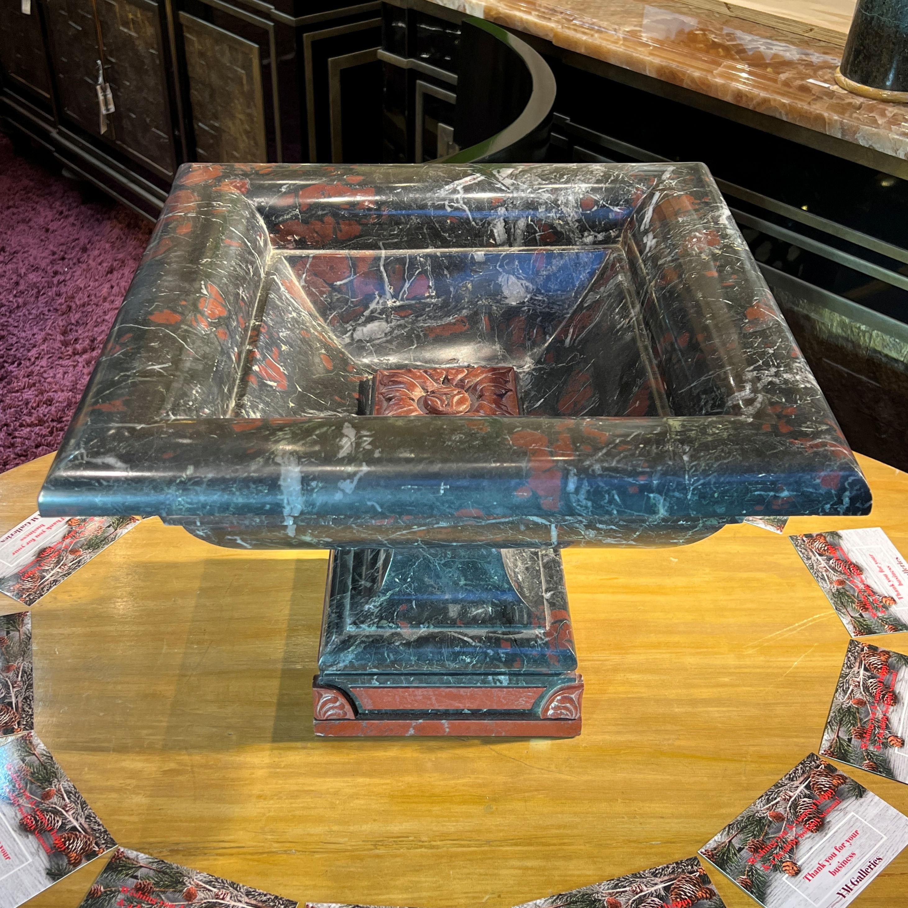 Our large neoclassical tazza carved from variegated charcoal colored marble with red and grey dates from the nineteenth century.

Provenance: Jay Waldmann, Waldmann Inc., Southampton, NY.

In good condition with restoration to losses at one