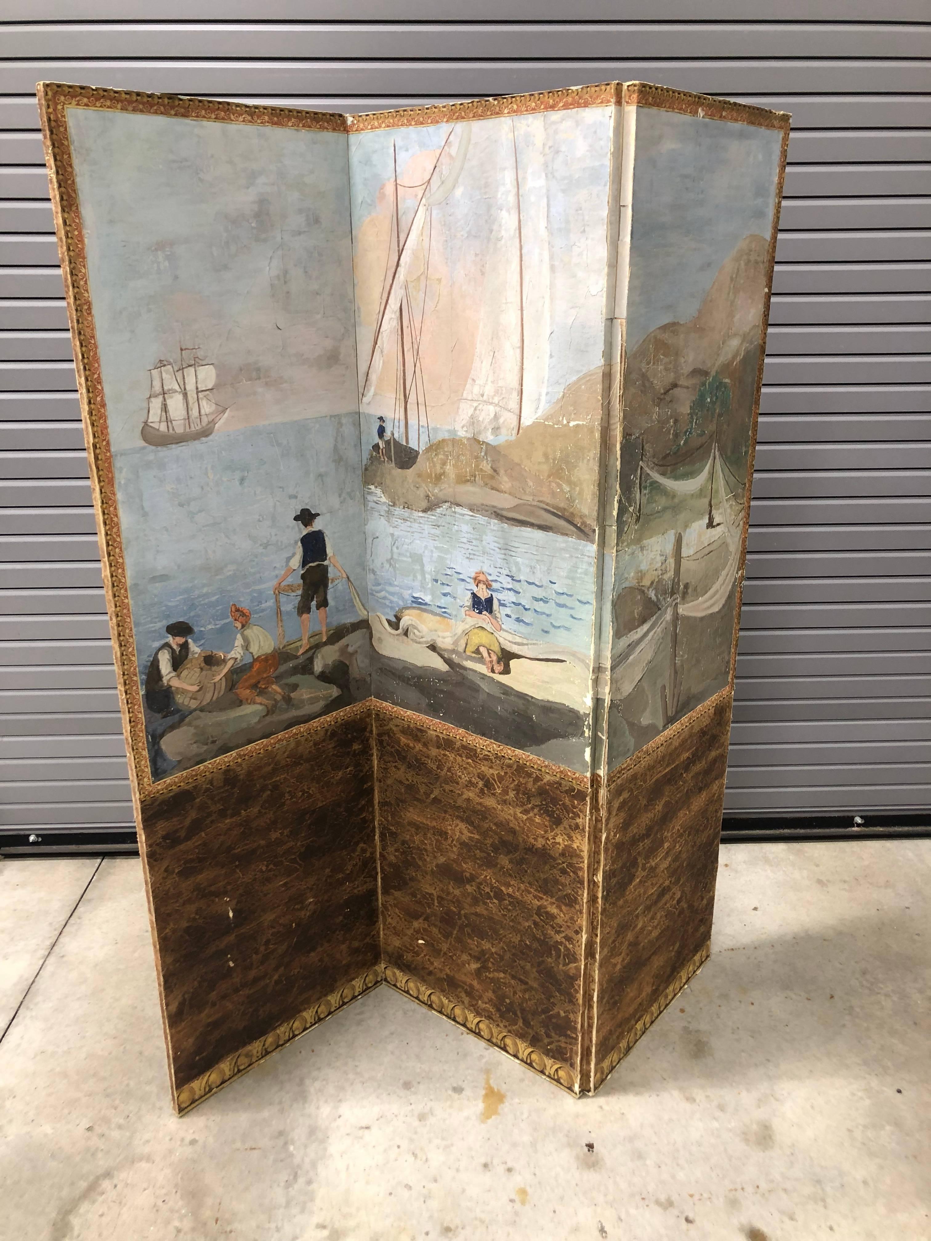 Continental hand-painted wallpaper three-section folding screen depicting a harbour scene with ships and figures on shore.

   