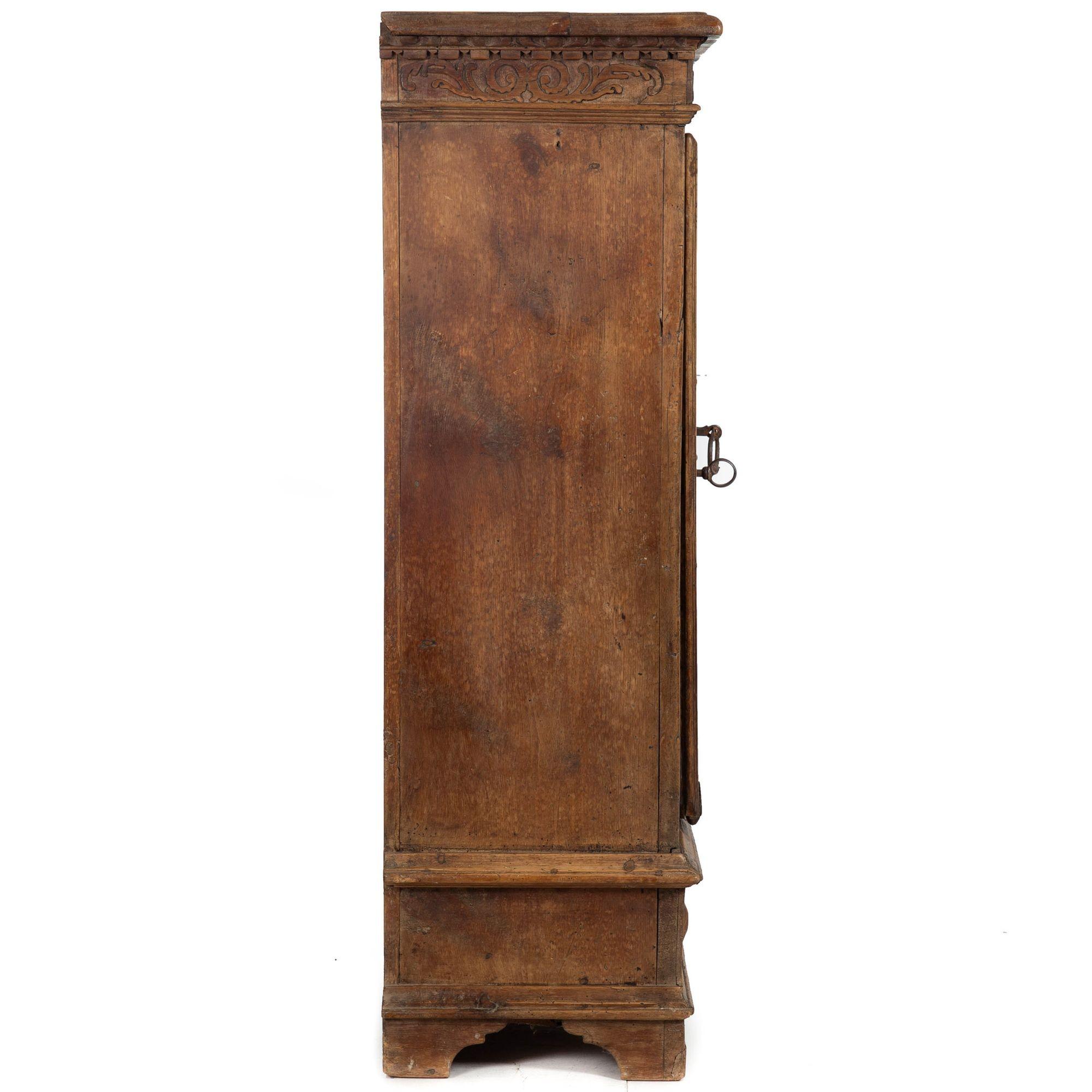 Continental Heavily Worn Carved One-Door Cupboard Cabinet of Small Size In Good Condition For Sale In Shippensburg, PA