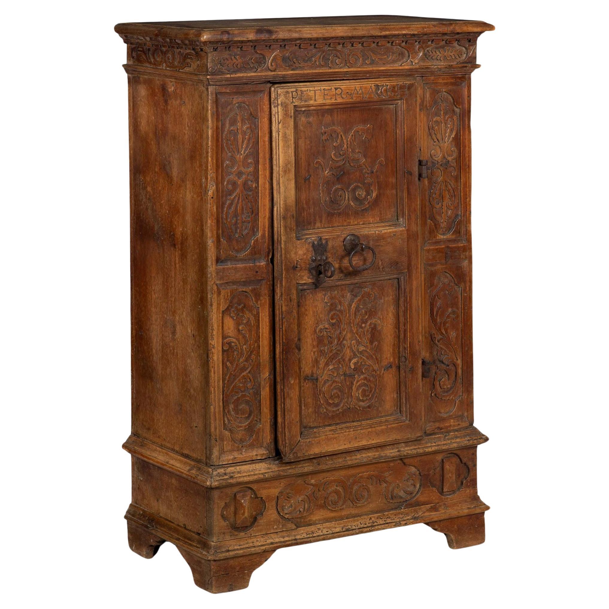 Continental Heavily Worn Carved One-Door Cupboard Cabinet of Small Size For Sale