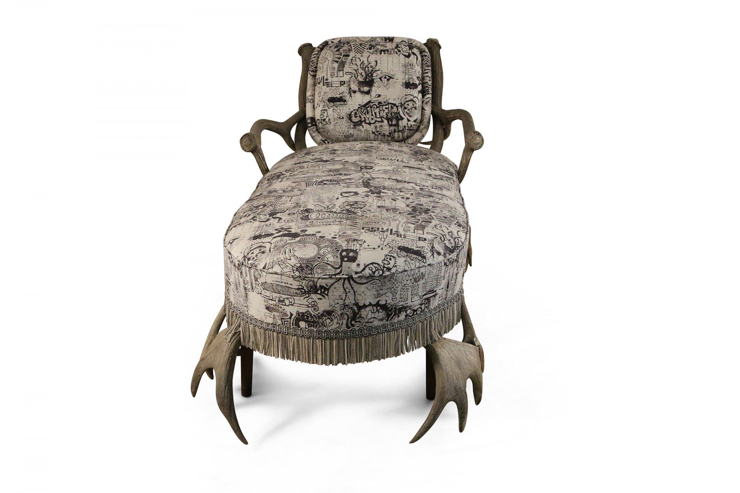 Continental (19th century-Probably German) horn and antler chaise with graphic print black and white upholstery and two matching throw pillows.
      
