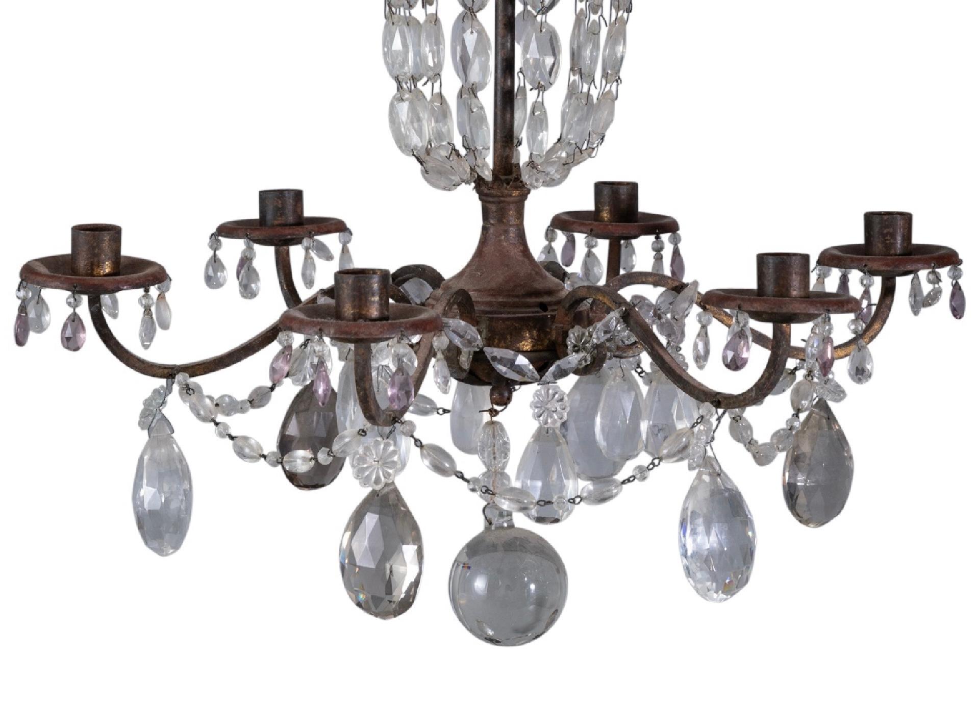 Early 20th century continental iron and cut glass six light chandelier. Chandelier features colorless glass pendants and beads. The iron has a not old mellow patina. Perfect for any setting.

