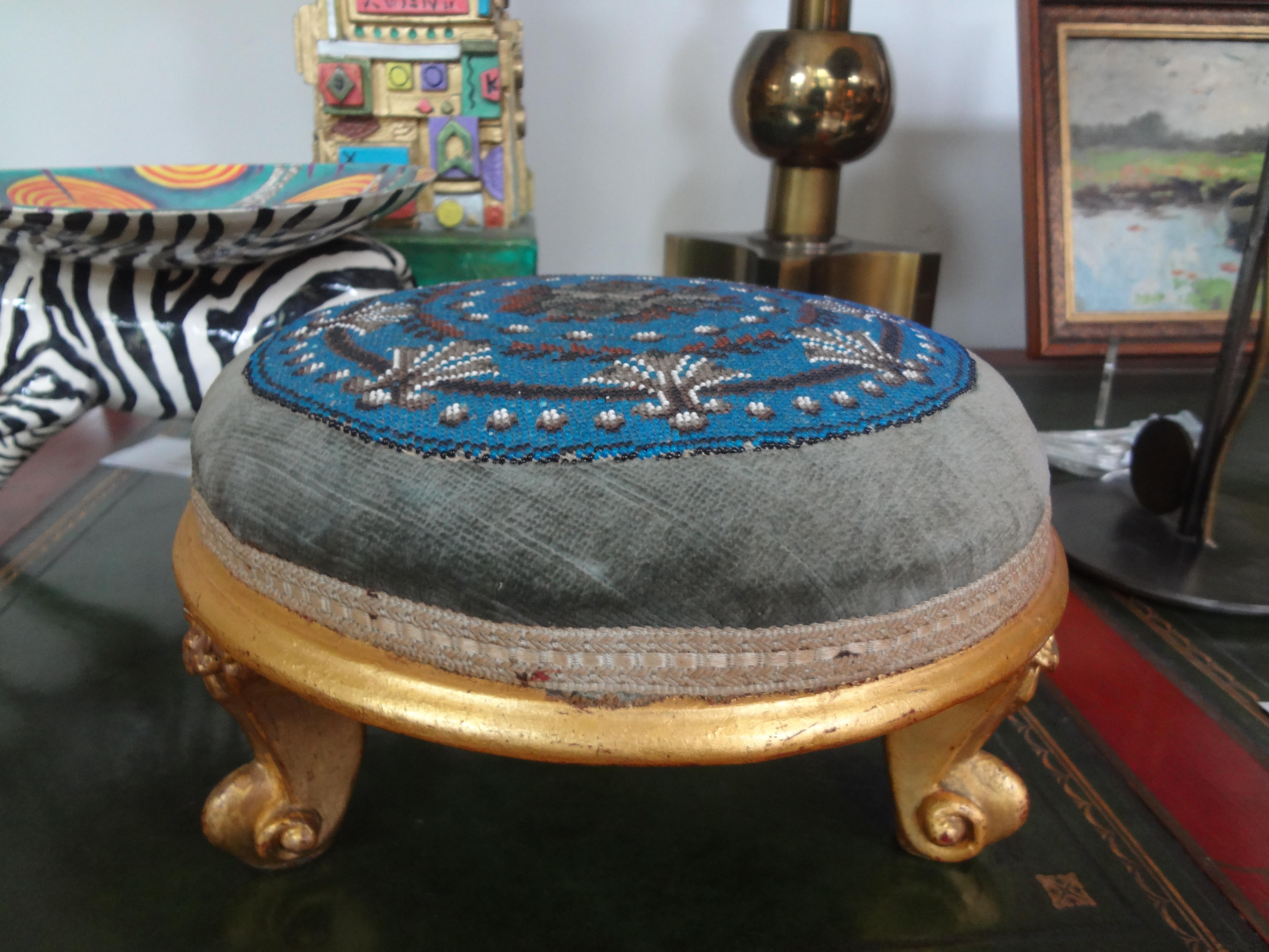 Continental Louis XV Style Beaded giltwood footstool.
Lovely Continental Louis XV style hand beaded gilt wood footstool or tuffet. This beautiful gilt footstool is in great condition and would work perfect as a display stand for a doll or precious