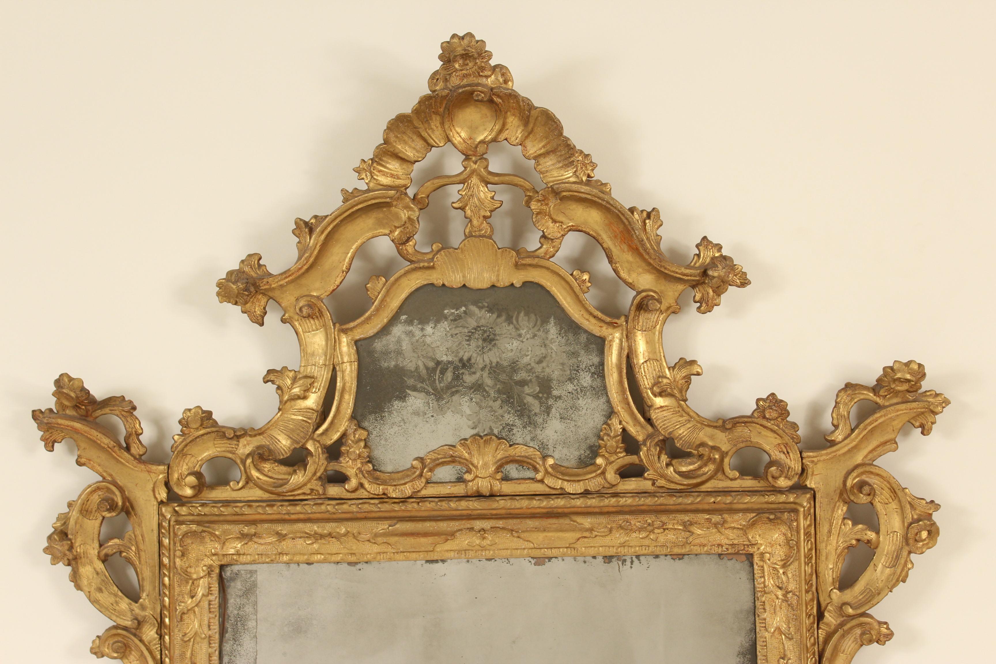 Continental Louis XV style carved giltwood mirror with upper etched glass panel, late 19th century.