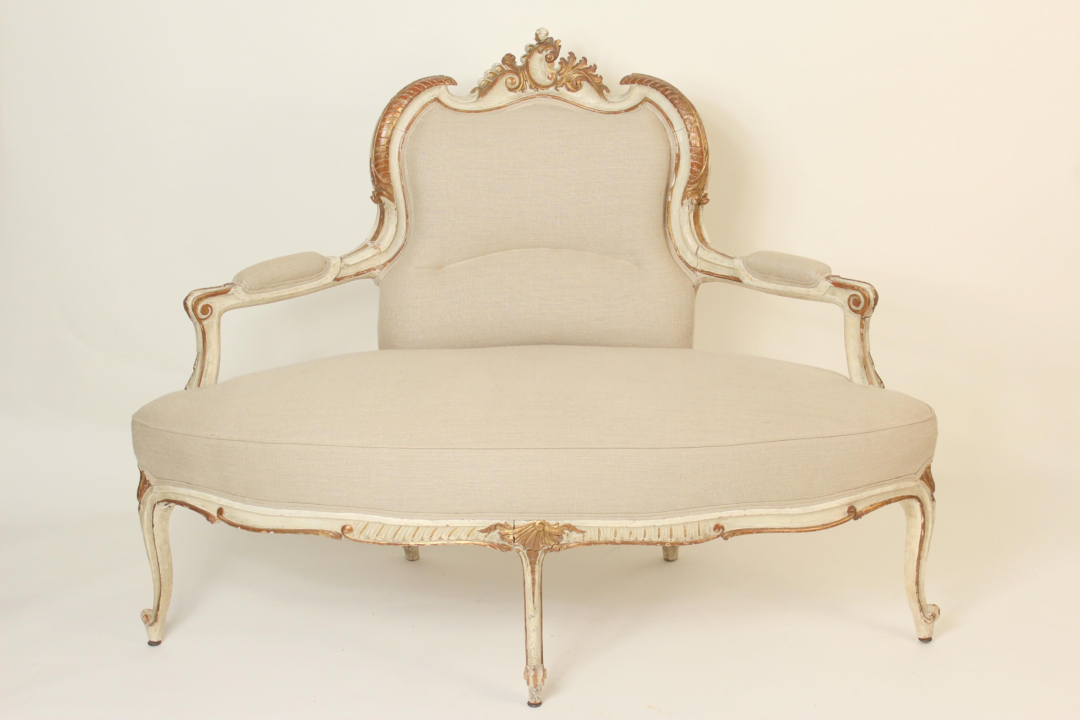 Continental Louis XV style painted and gilt decorated corner settee, 19th century.