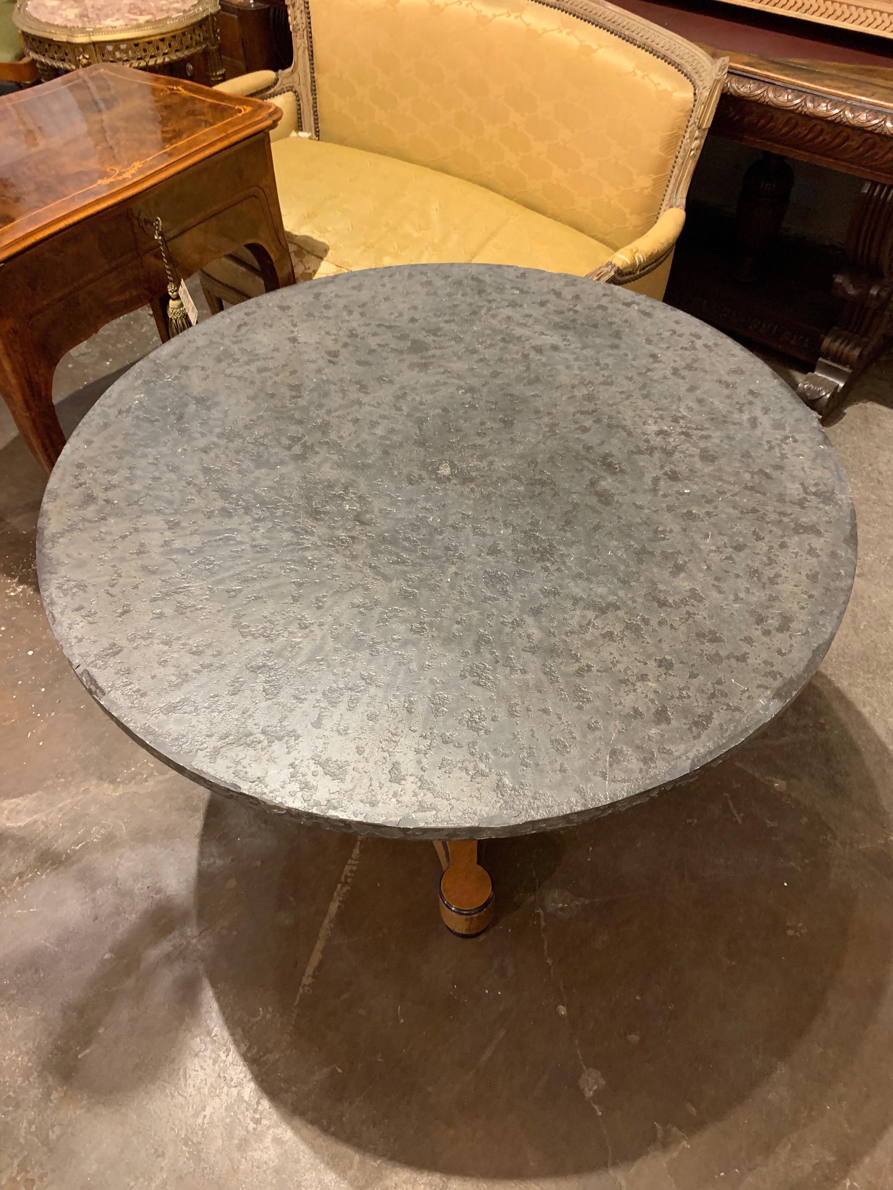Very handsome continental mahogany and ebony center table. The top is made of grey colored slate. A very functional and beautiful table.
