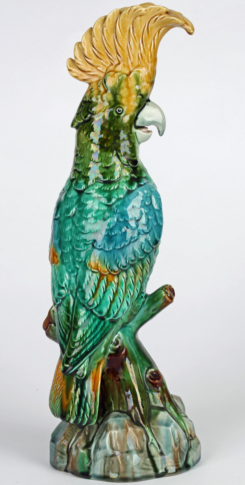 A rare and unusual Continental Majolica pottery figure of a cockatoo on a perch dating from around 1880. The figure is lightly potted and very well detailed with the figure perched on a rockwork and tree stump base painted in naturalistic coloured