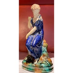 Continental Majolica Pottery Figure of a Lady and Bird, 19th Century
