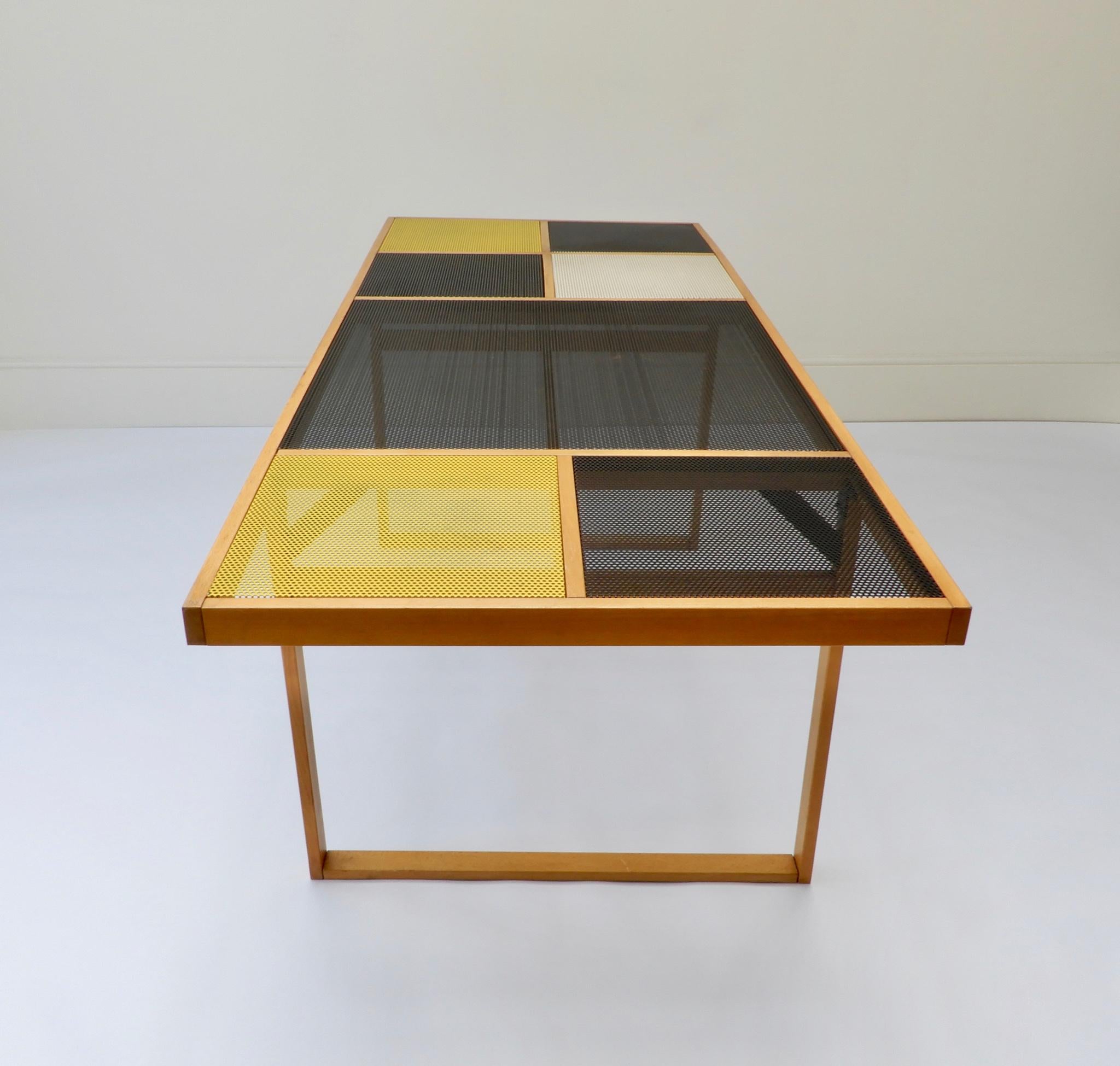 Continental metal and wooden perforated black table with yellow and white panels.
Late 1960s-early 1970s.