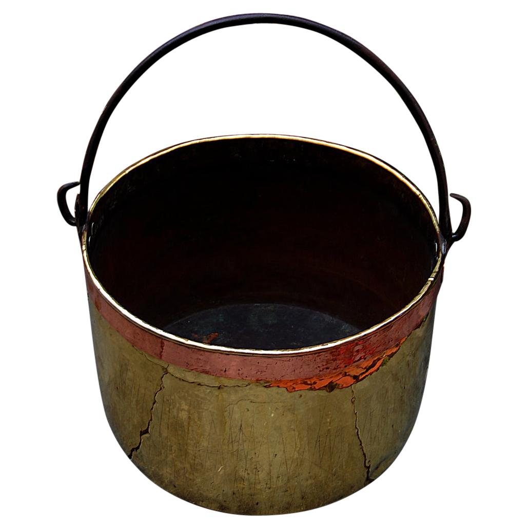 Patinated iron cauldron / firewood holder at 1stDibs