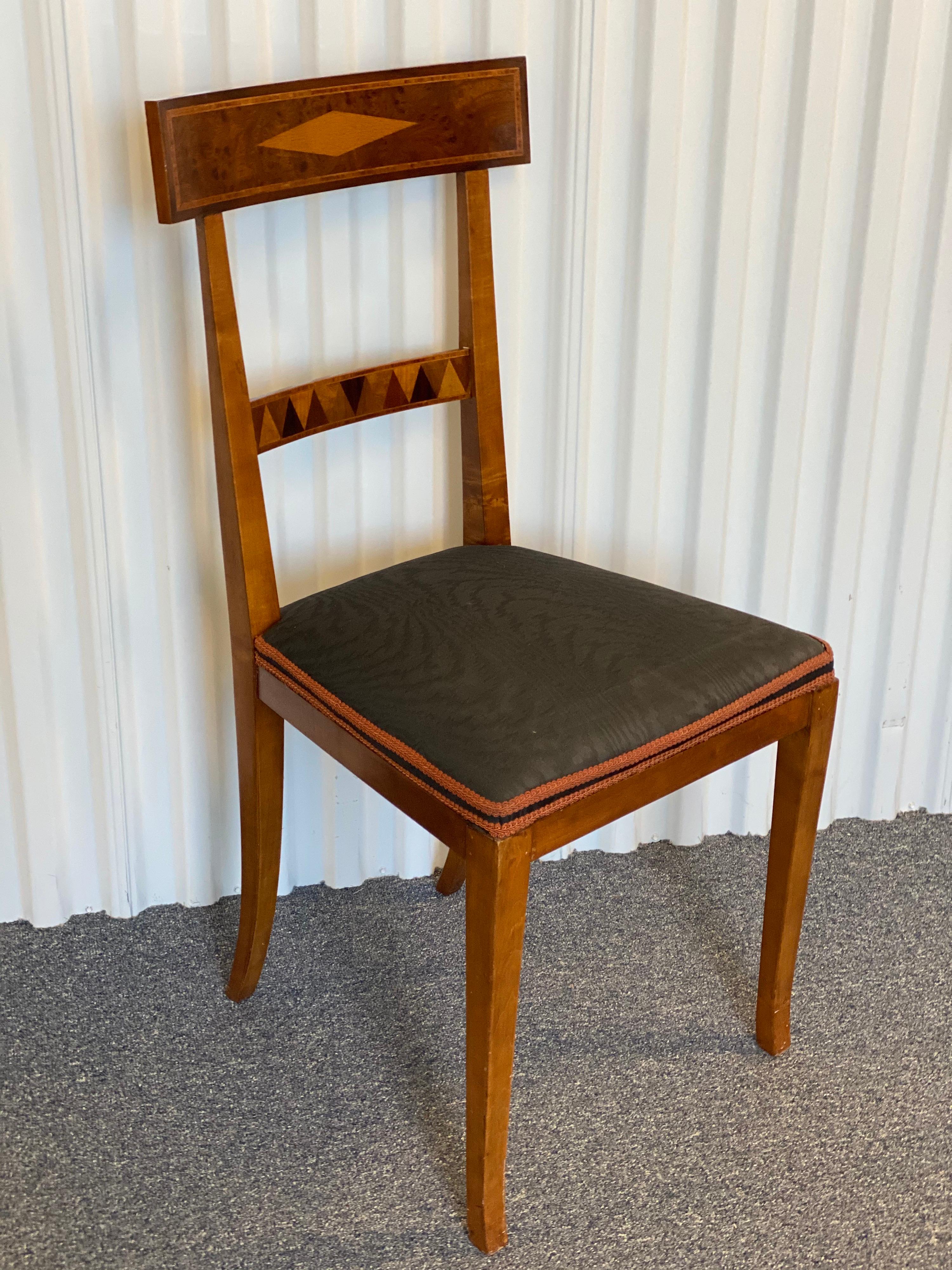 Continental neoclassical style mahogany side chair. Made in beautiful mahogany wood with an upholstered blue-gray-colored moire silk seat. This chair has a burlwood and fruitwood parquet design on the front cross rail as well as a simpler diamond
