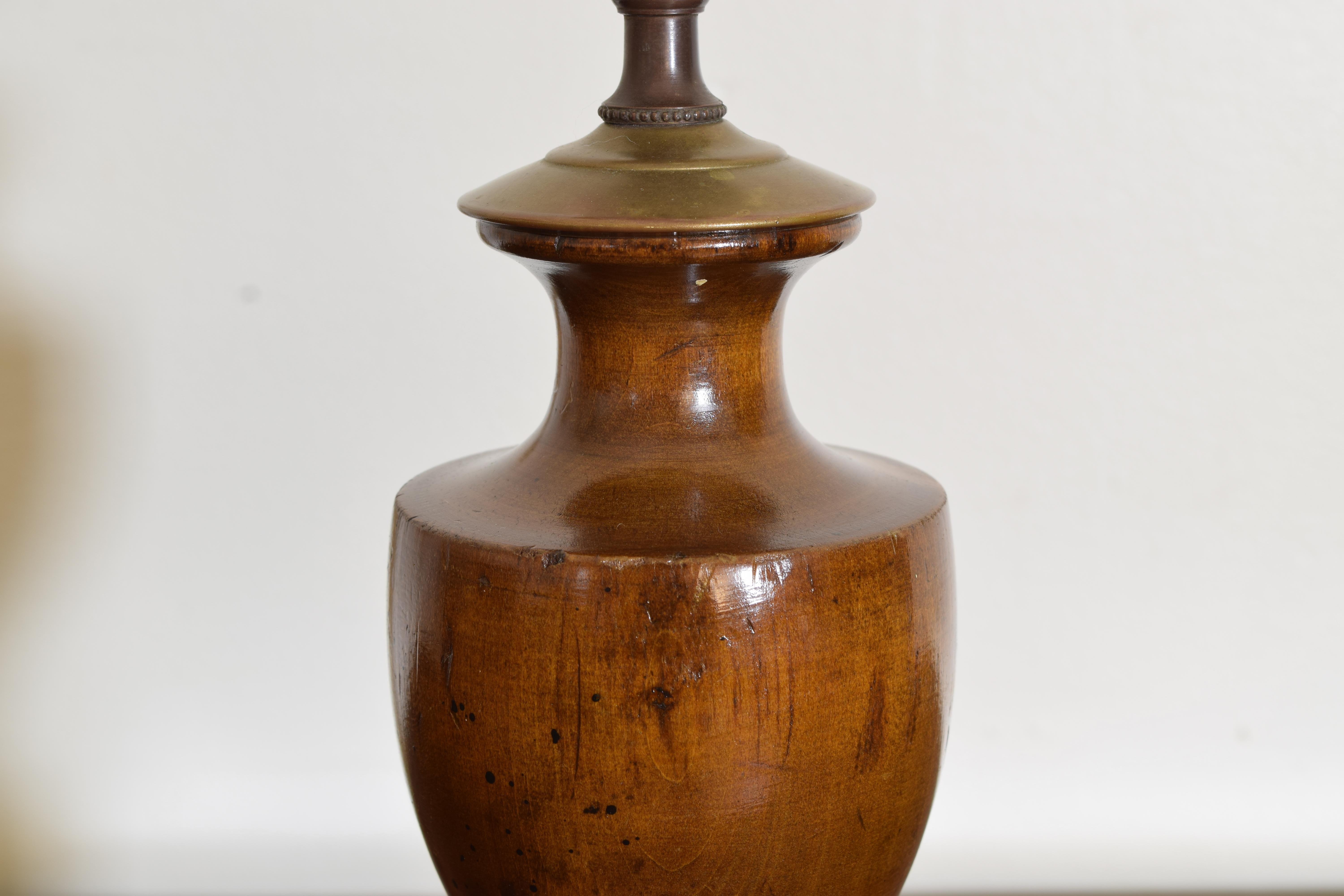 20th Century Continental Neoclassical Style Turned Walnut Urn-Form Table Lamp, ca. 1900.