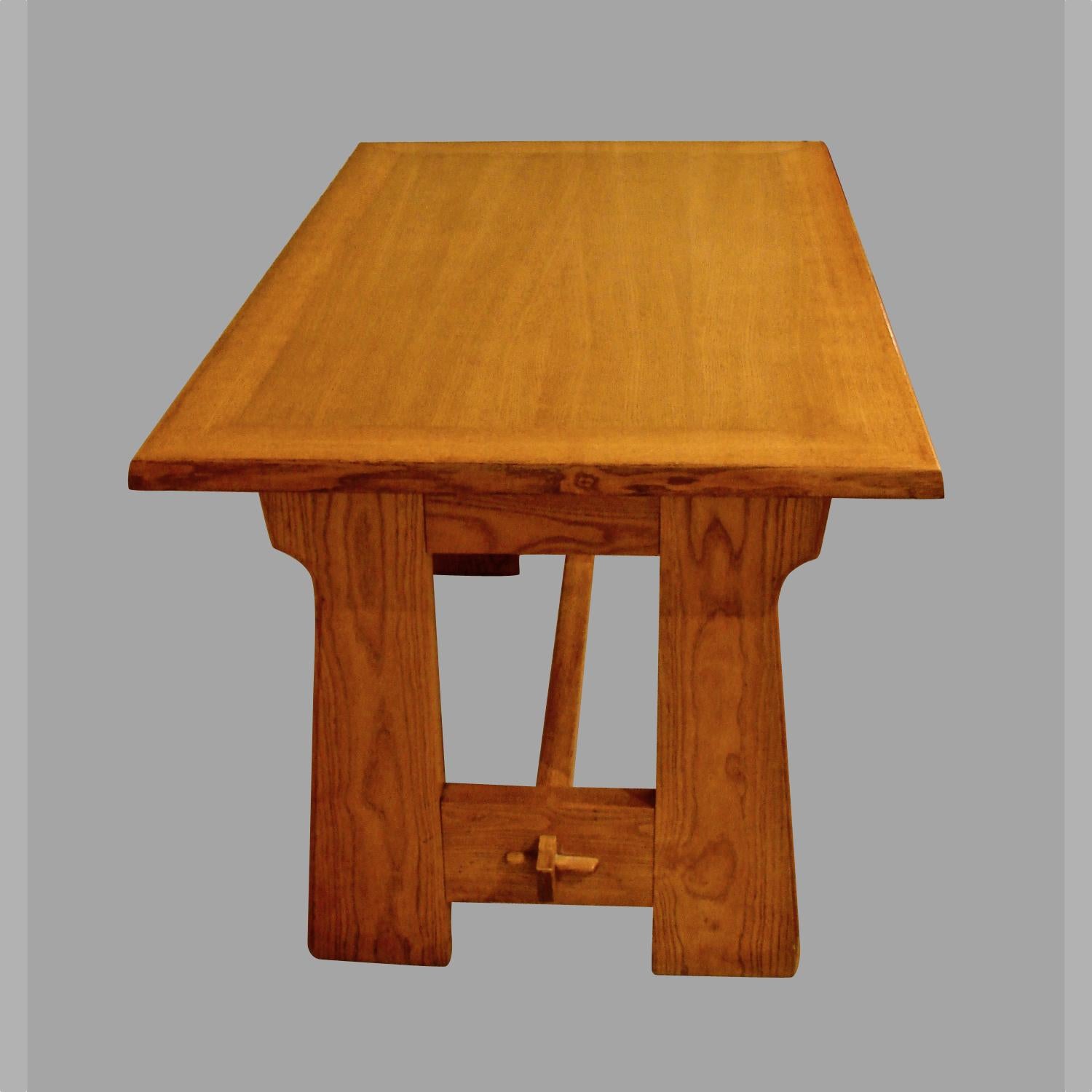 A well-made northern European light oak work or dining table with two frieze drawers, the molded legs connected by an H stretcher with mortise and tenon joinery. The simplicity and craftsmanship of this piece is noteworthy. Circa 1910.