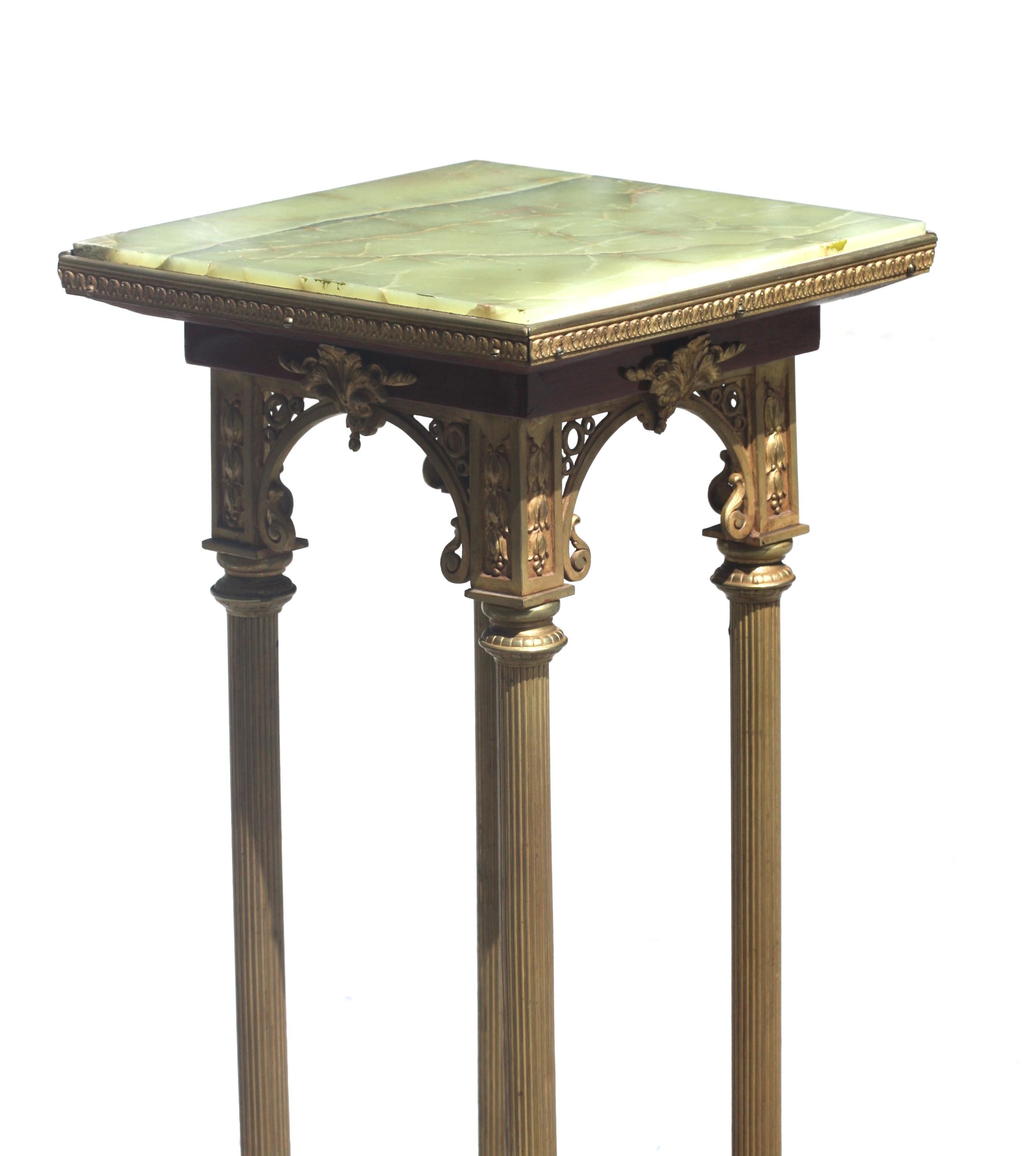 
Continental Onyx and Gilt-Bronze Pedestal
The square onyx top on four reeded columnar legs, above a mahogany platform, on bronze paw feet.
Height 30.5 in. (77.47 cm.), Width square 12 in. (30.48 cm.)