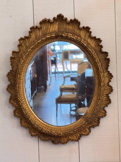 Continental Oval Mirror in an Ornate Gilt Gesso Frame