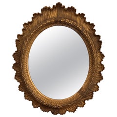 Continental Oval Mirror in an Ornate Gilt Gesso Frame