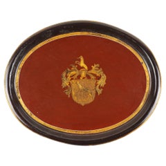 Continental oval tole tea tray with gilt armorial, 1825-50