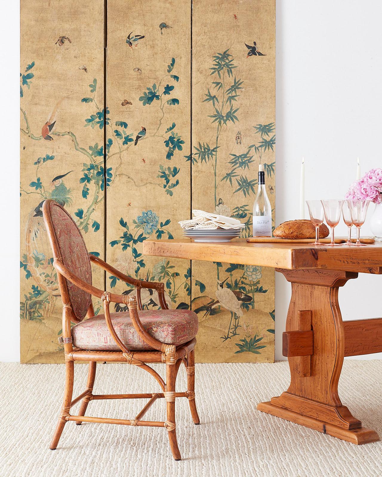 Fascinating continental chinoiserie painted wallpaper screen depicting flora and fauna. Beautifully decorated with birds and trees on one side with a light background. The reverse side is embellished with decoupage birds in bright colors over a dark