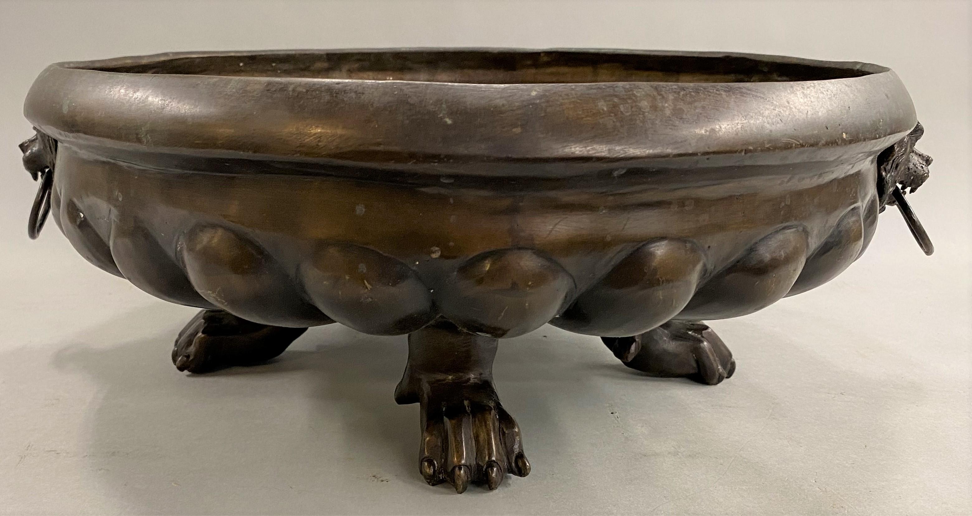 19th Century Continental Patinated Bronze Jardiniere with Lions Heads and Paw Feet For Sale