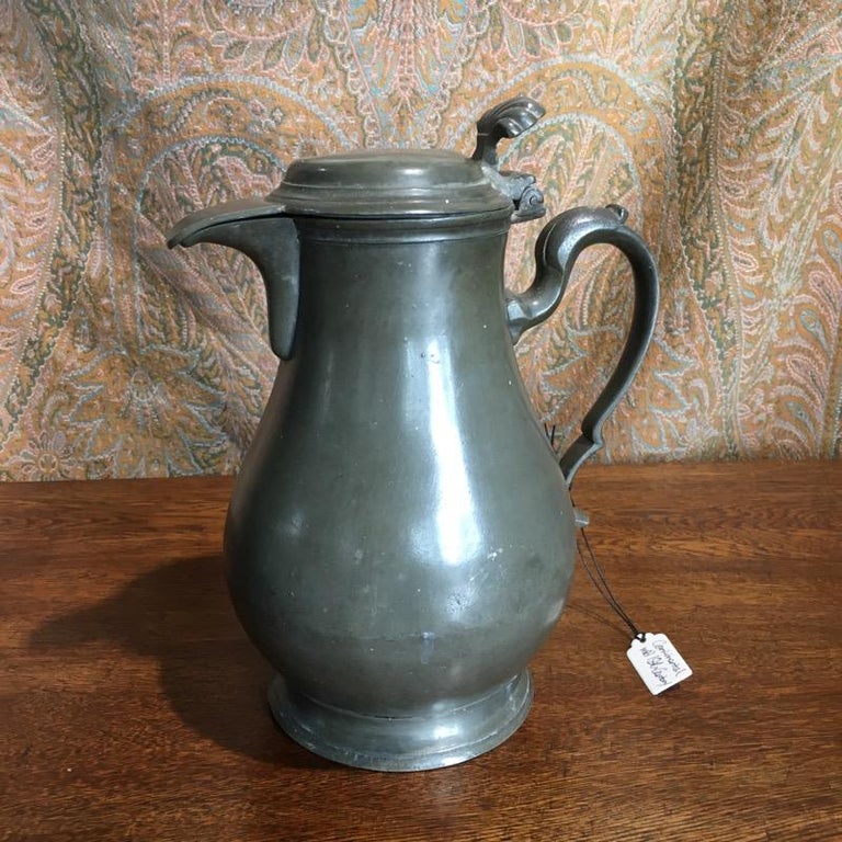 18th Century and Earlier Continental Pewter Covered Jug, Baluster Shaped with Shell Thumb Piece For Sale