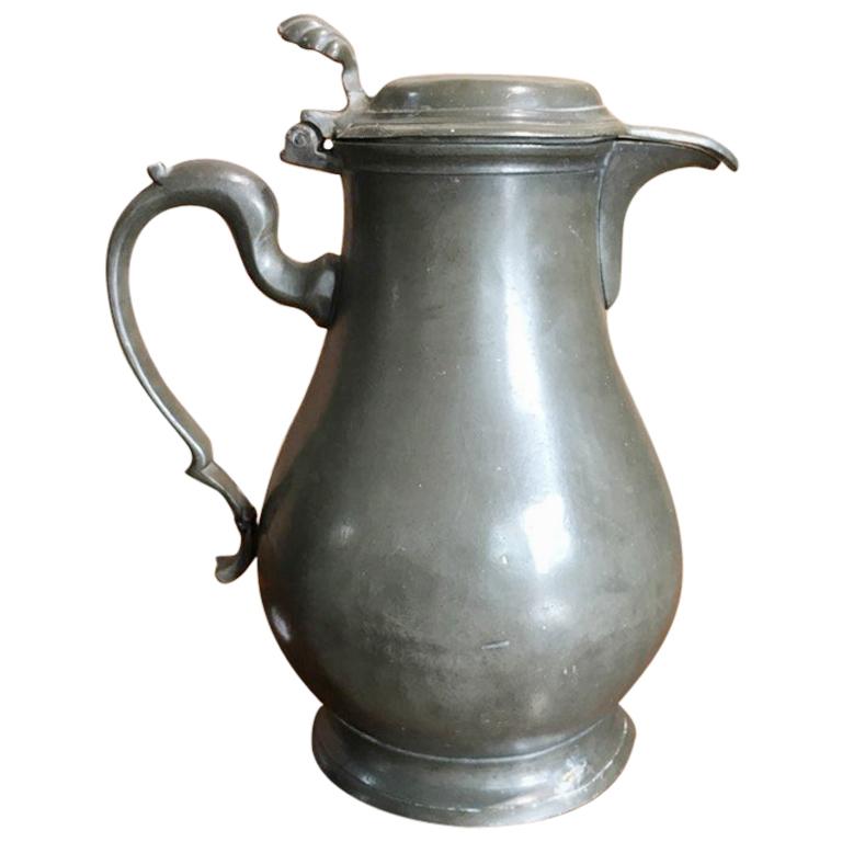 Continental Pewter Covered Jug, Baluster Shaped with Shell Thumb Piece For Sale