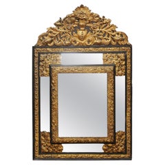 Continental Repousse 
Wood Mirror with Flowers and Foliage Design