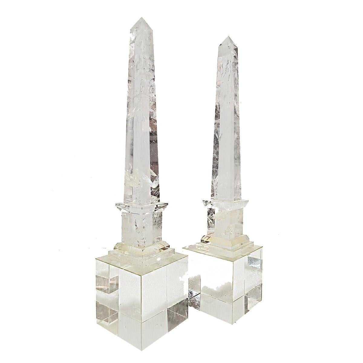 A pair of Continental Rock Crystal obelisks, from France, late 19th Century. 

The obelisks proper are 12 inches high, each mounted on a 4-inch crystal cube of a later date, for a total height of 18 inches. The obelisks are in their original
