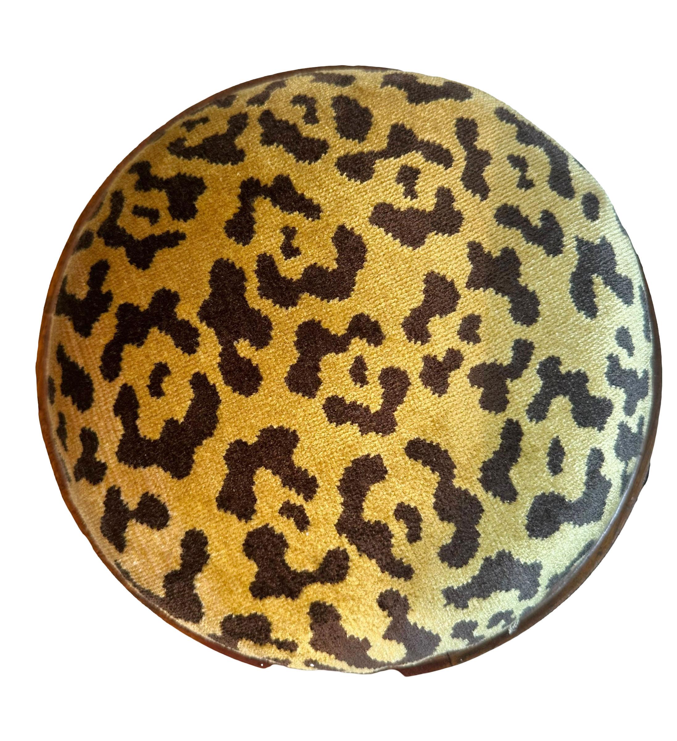 A Dutch style late 19th century continental stool covered in leopard silk and cotton Scalamandre fabric. It sits on brass ball feet and has a wonderful inlay. 