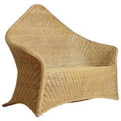 Used Continental Shaped Wicker Settee, circa 1970