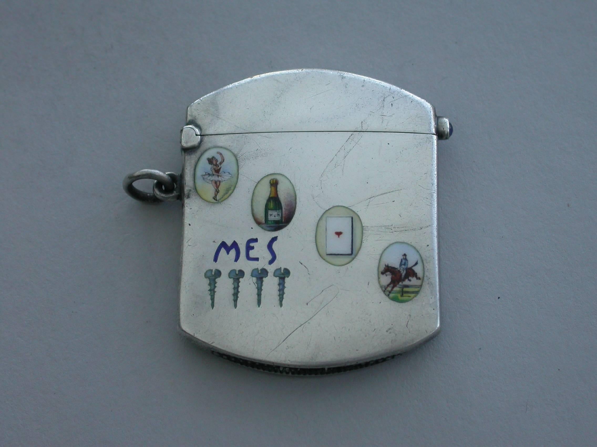 A fine 19th century German .800 standard silver (with French import marks) and enamel Vesta Case of rounded rectangular form with attached suspension ring, the hinged lid with cabochon sapphire catch. The face enamelled with four of man's vices