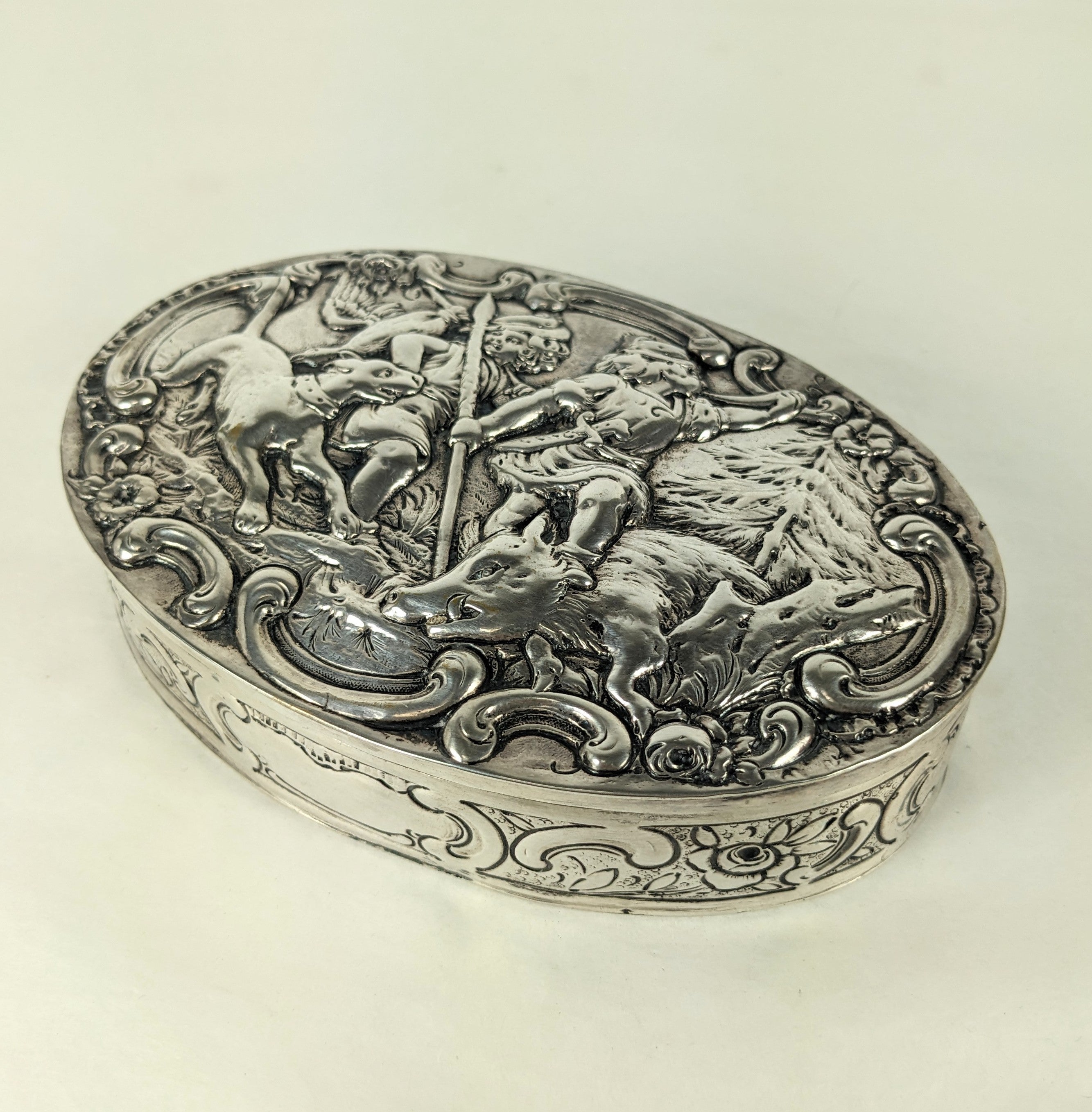 Elegant Continental Silver Hunt Scene Repousse Box. Hand repousee with hunters with boar, dog and boar. 1900's European hallmarks. Handmade. 5.75