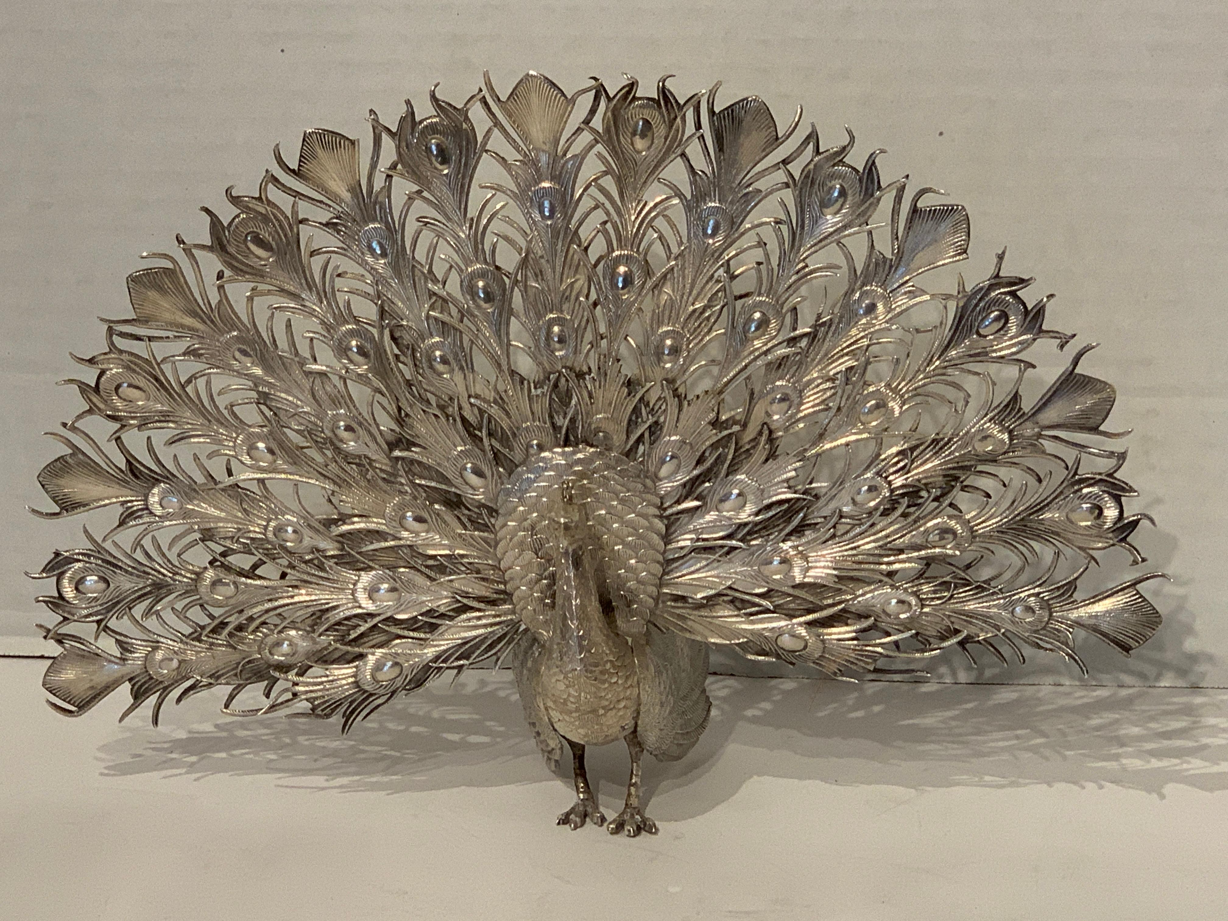 Continental silver model of a peacock, realistically cast and modeled, stamped on the foot .800 and other indistinct hallmarks. Weighs approximately 7 troy ounces.