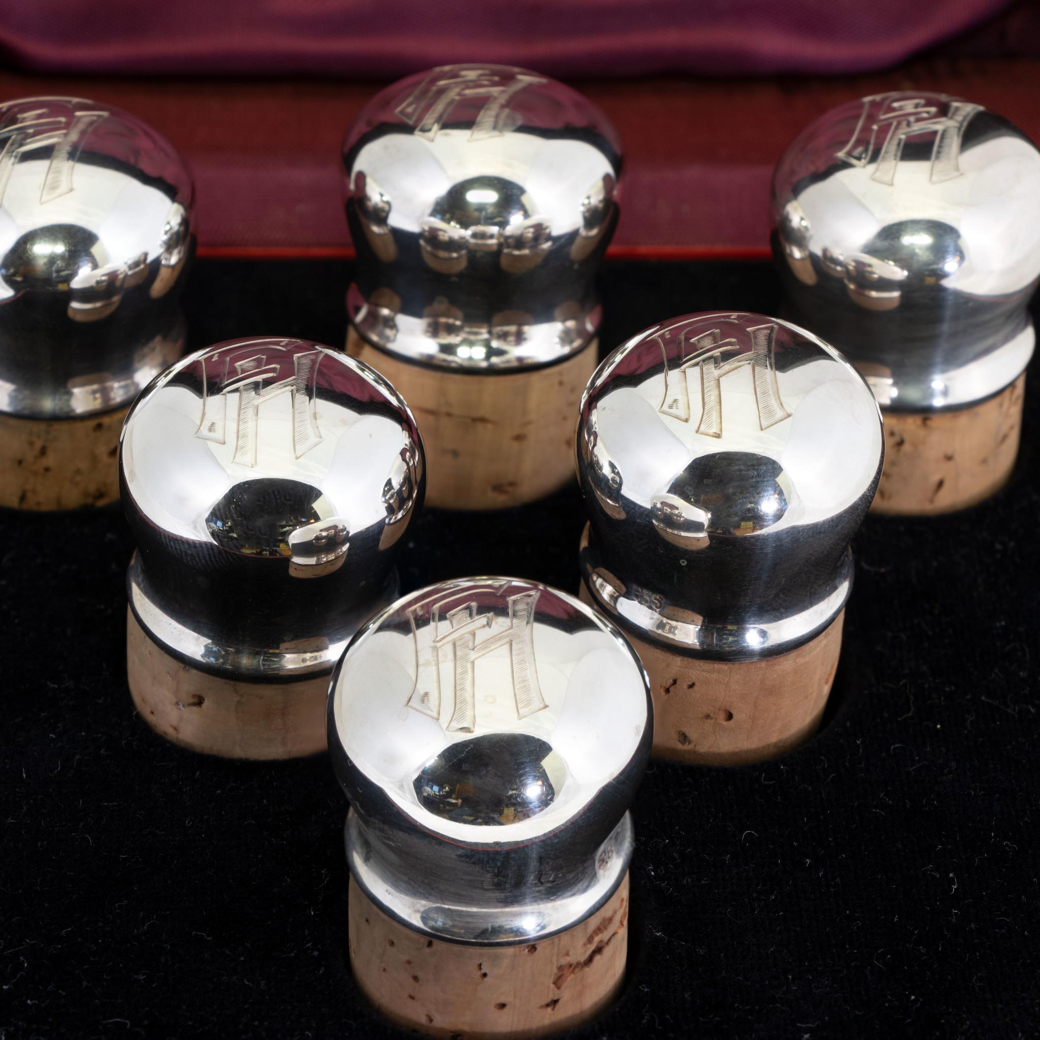 Continental set of six silver capped wine cork stoppers. Monogrammed 
