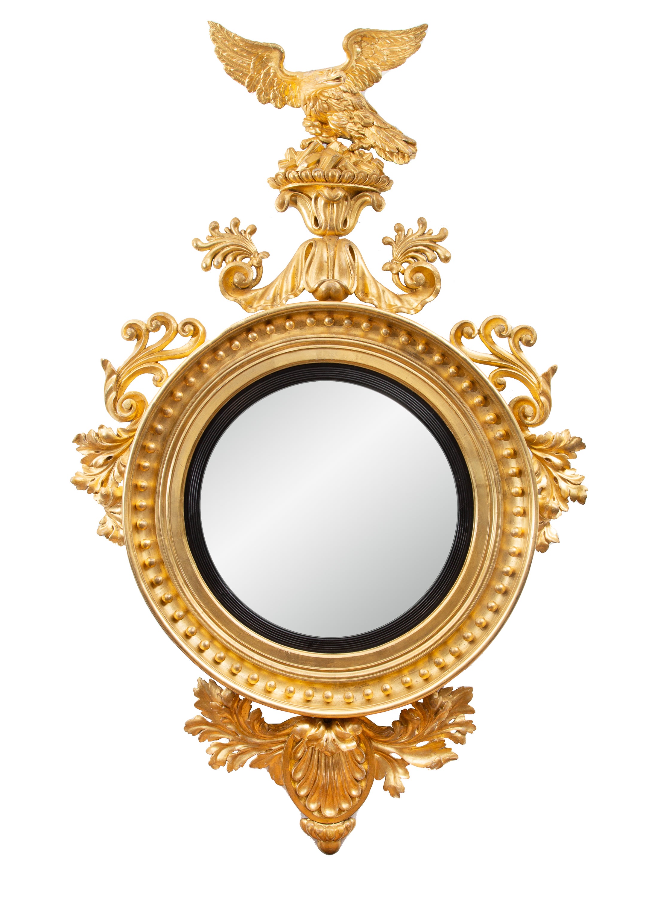 This is an exceptional 19th century water-gilded Continental convex mirror with a bold, prominent eagle situated above a convex mirror plate framed by gilt beads and scrolling ornamentation.