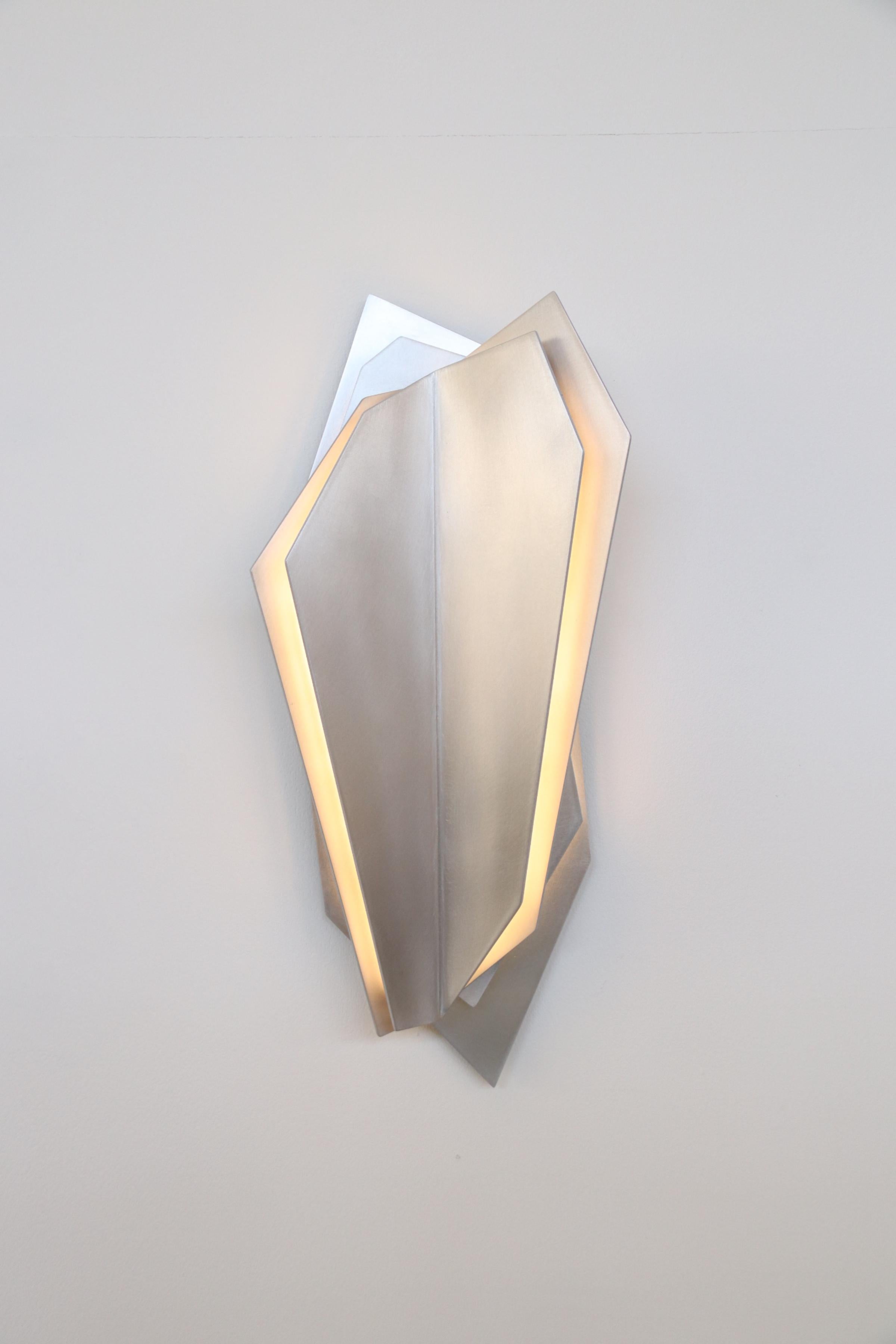 Continuum 500 Wall Sconce by Lost Profile Studio
Dimensions: W 22 x D 9 x H 50 cm 
Materials: Brass, Glass, Aluminium, LED
Finishes:
Aged Brass (waxed)
Blonde Brass (waxed)
Brushed Aluminium (waxed)
Dark Bronze (waxed))

Notes: 12v light fixture,