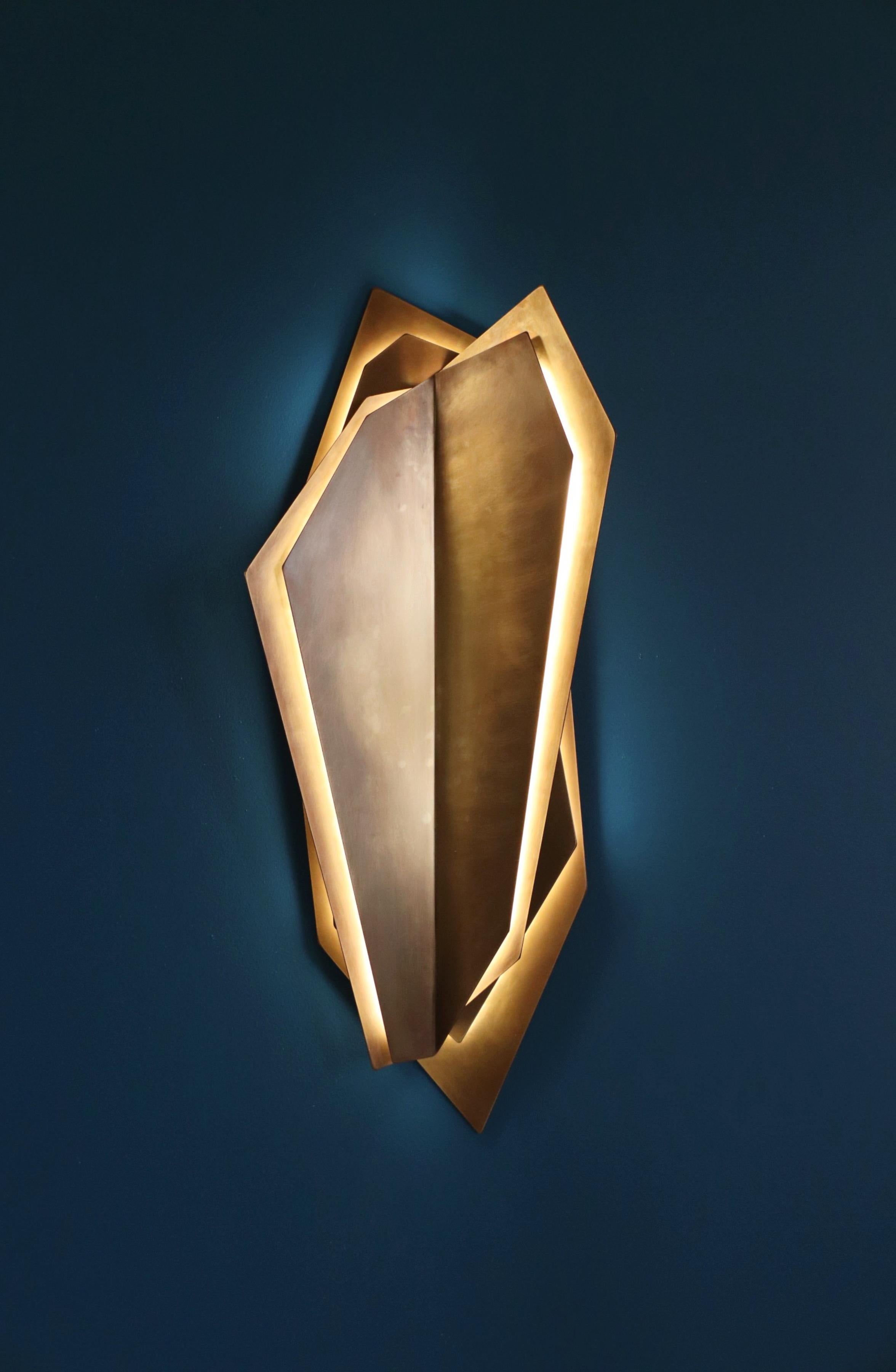 Continuum 900 Wall Sconce by Lost Profile Studio
Dimensions: W 38 x D 12 x H 90 cm 
Materials: Brass, Glass, Aluminium, LED
Finishes:
Aged Brass (waxed)
Blonde Brass (waxed)
Brushed Aluminium (waxed)

Notes: 12v light fixture, supplied with a 12v,