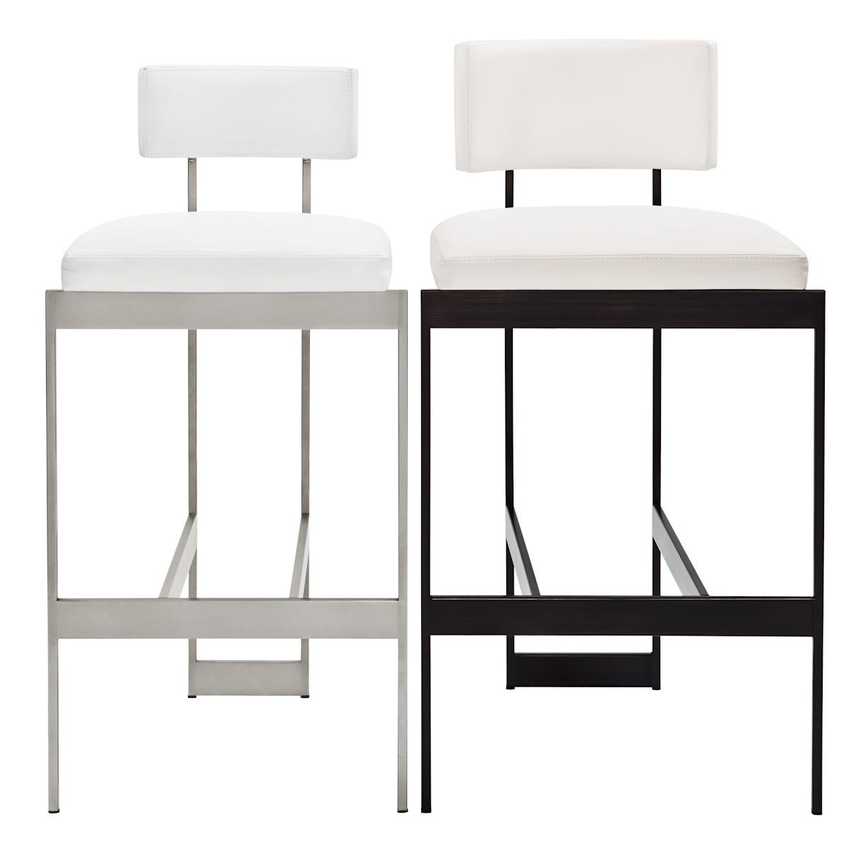 Bar stool with sculptural steel frame tightly upholstered seat and back with top-stitched seams. Nylon glides. Seat height is approximately 29
