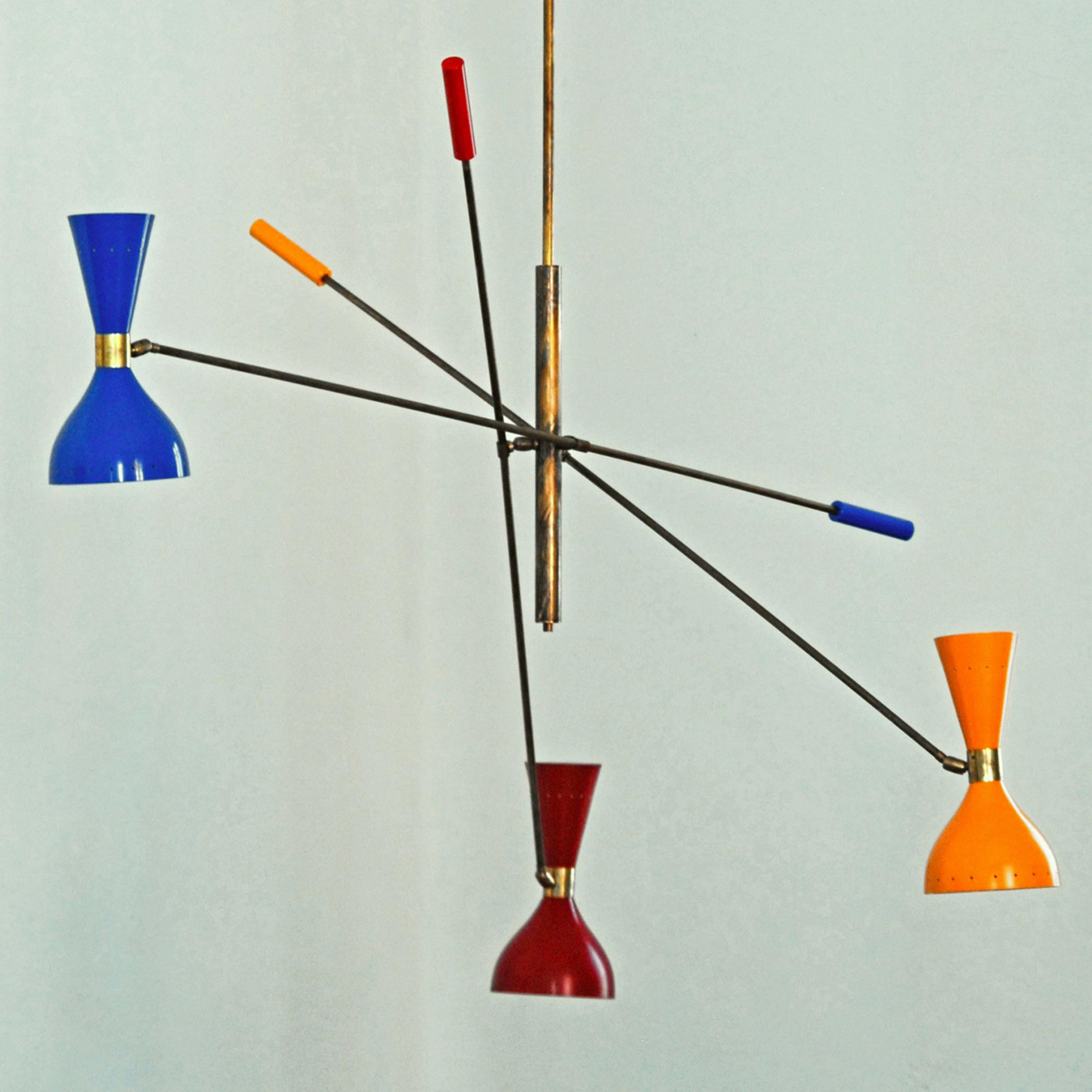 This colorful chandelier will add a dash of color and a dynamic accent to a modern interior. Inspired by iconic designs of the '50s, this piece features a natural solid brass structure with three arms balancing a double aluminum shade on one side