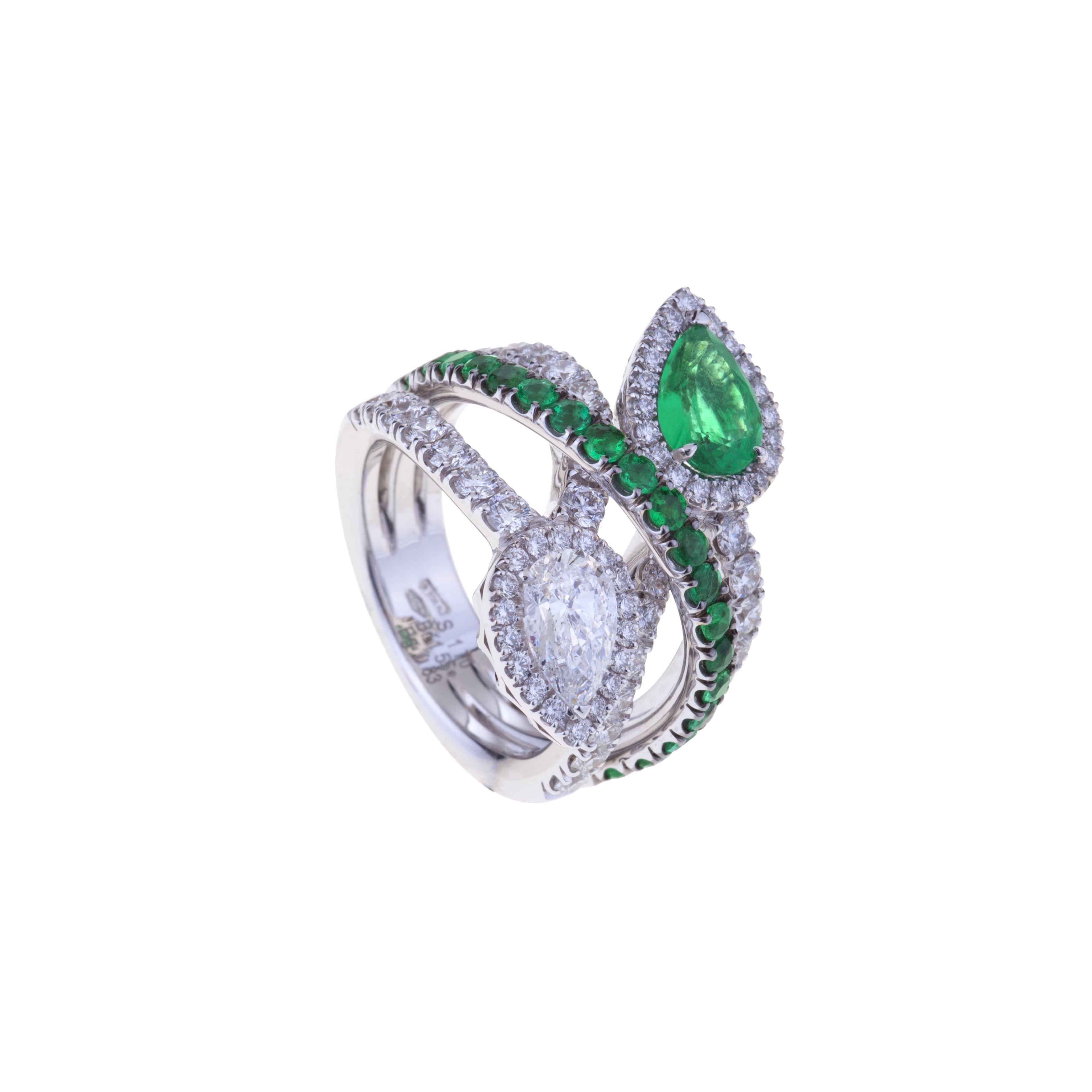 Contrarié Ring Diamond and Emerald Drop Cut .
Modern Design for this Contarié Ring with two Drop Cut Diamond and Emerald  and pave triple cirlce.  Diamonds are ct. 2.38 and Emerald are ct. 1.70. 
Gold weight is gr. 13.30.
Designed in