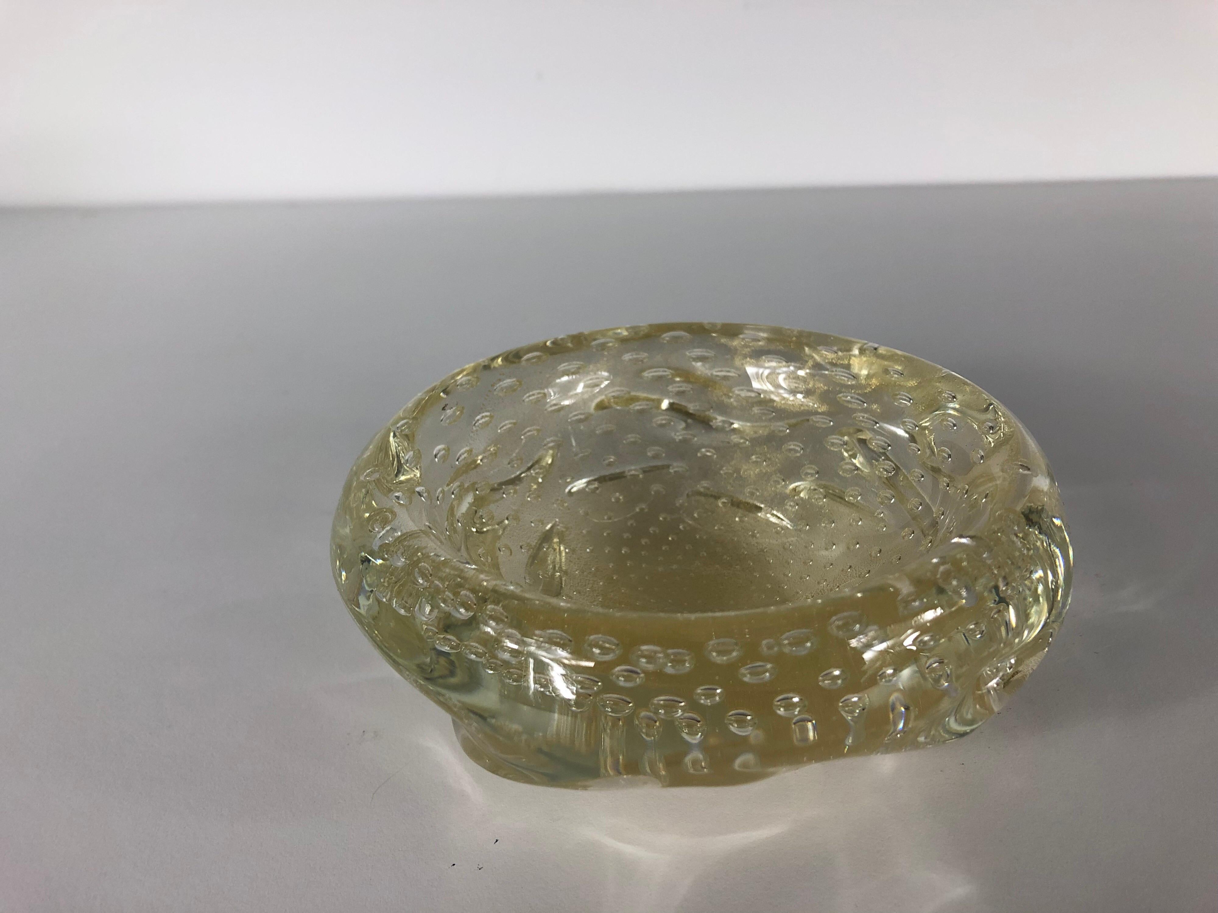 A single muted yellow controlled bubble Italian Murano bowl. Organic shape.