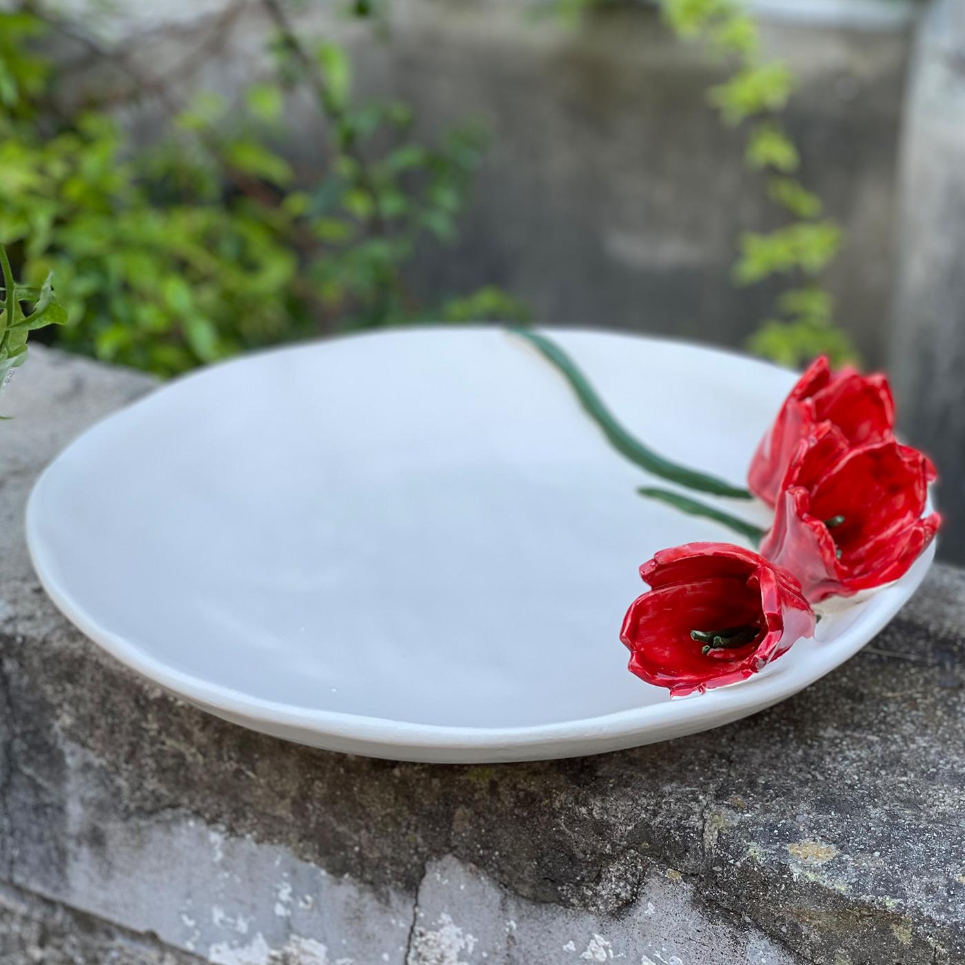 Plate in ceramic with tulips in reliefs. This piece can be use for food or as a centerpiece.