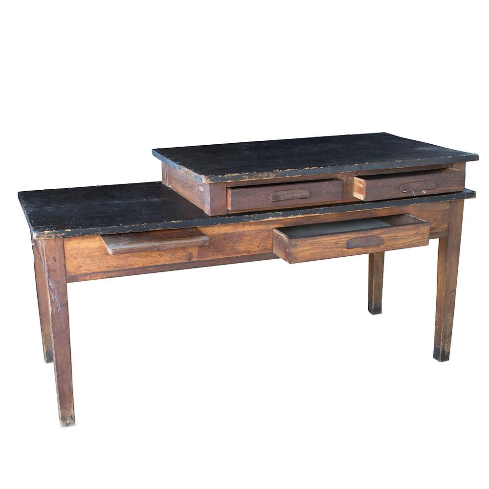 This fun and rustic dual-tier table came from the Mt. Angel Benedictine Convent and dates to the 1930’s. Used as a work table by the sisters, the tiered construction is visually interesting and makes for a fun piece of furniture. The black tabletops
