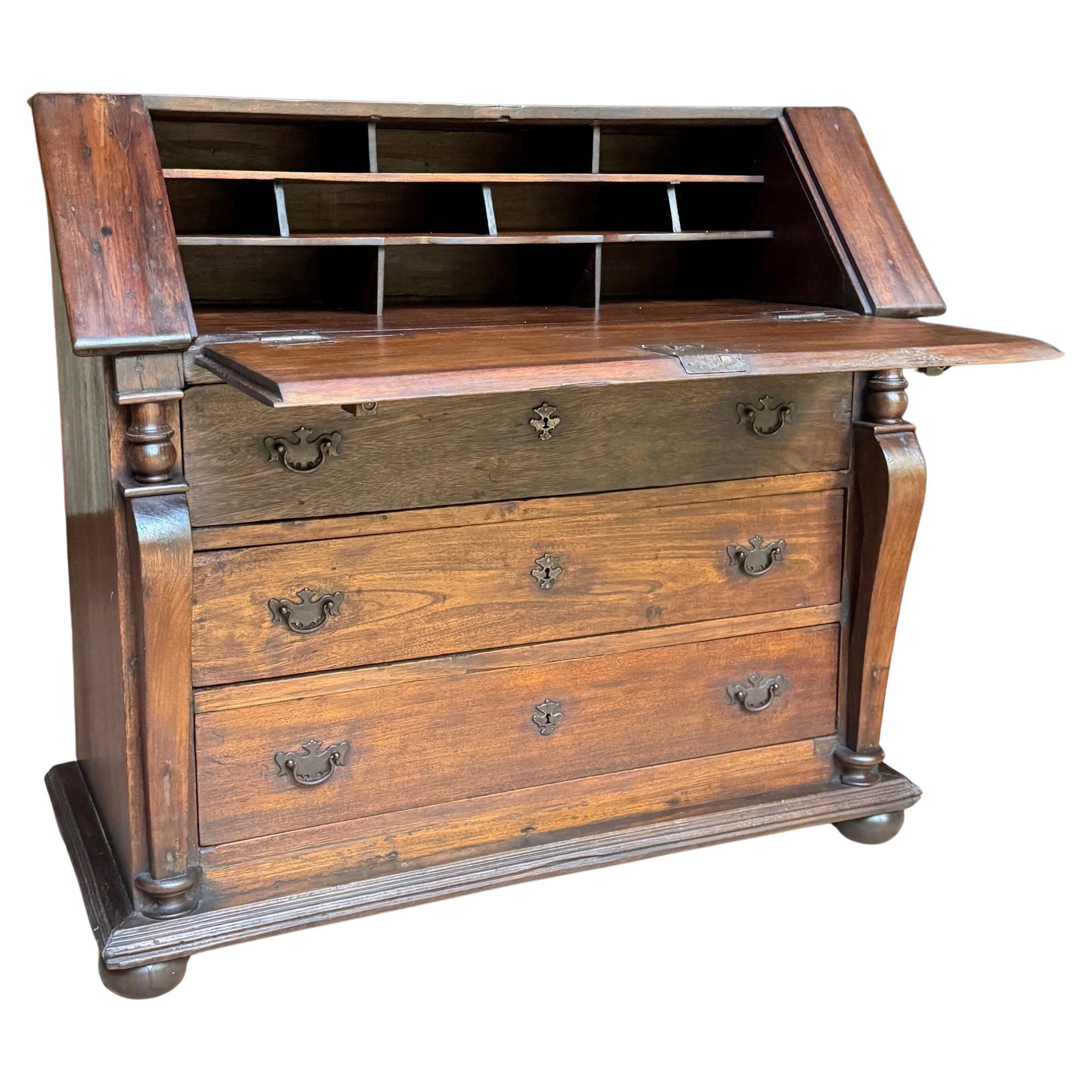 Conventual 18th-Century European Bureau – Rustic Devotion in Solid Wood
A rare and evocative example of 18th-century conventual furniture, this European bureau exudes the sober dignity and enduring strength typical of monastic commissions. Crafted