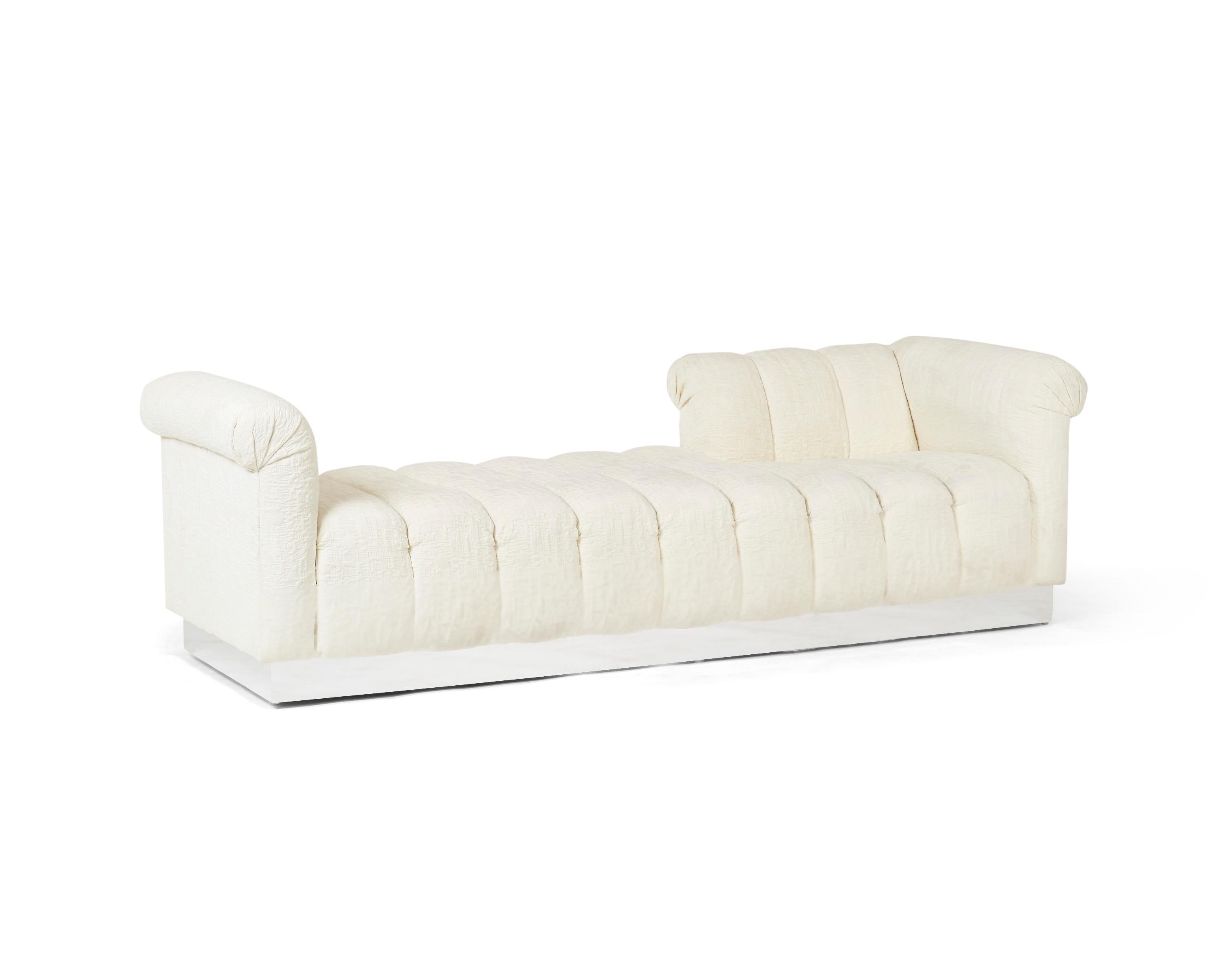 Chic channel tufted tete-a-tete sofa/chaise in original graphic white upholstery with chrome base.