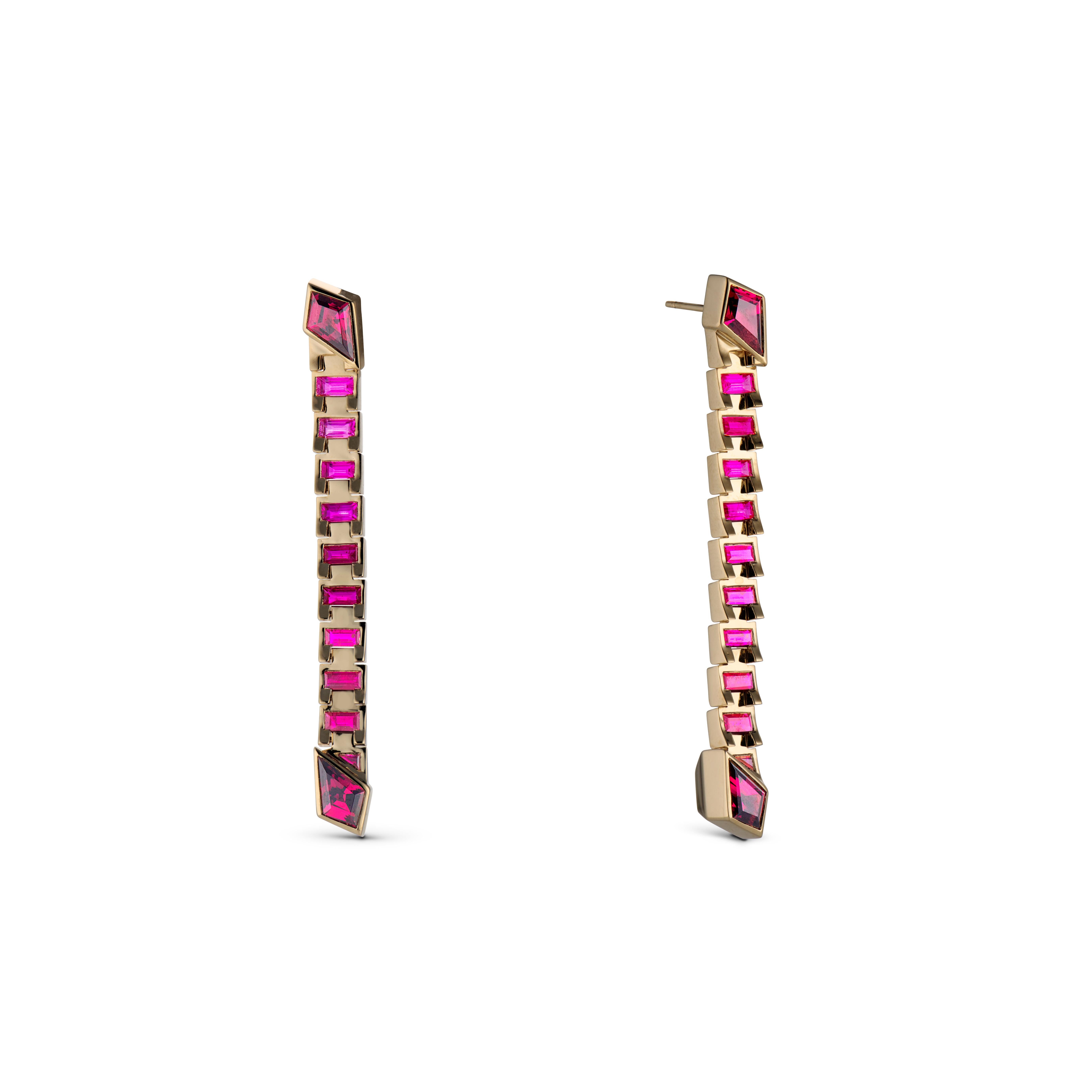 The ARIEL DROP HOOPS defy expectations as a pair of earrings that offer versatility and distinctive style. Each baguette is connected by a precisely designed hinge, allowing these striking statement earrings to be worn either vertically for a